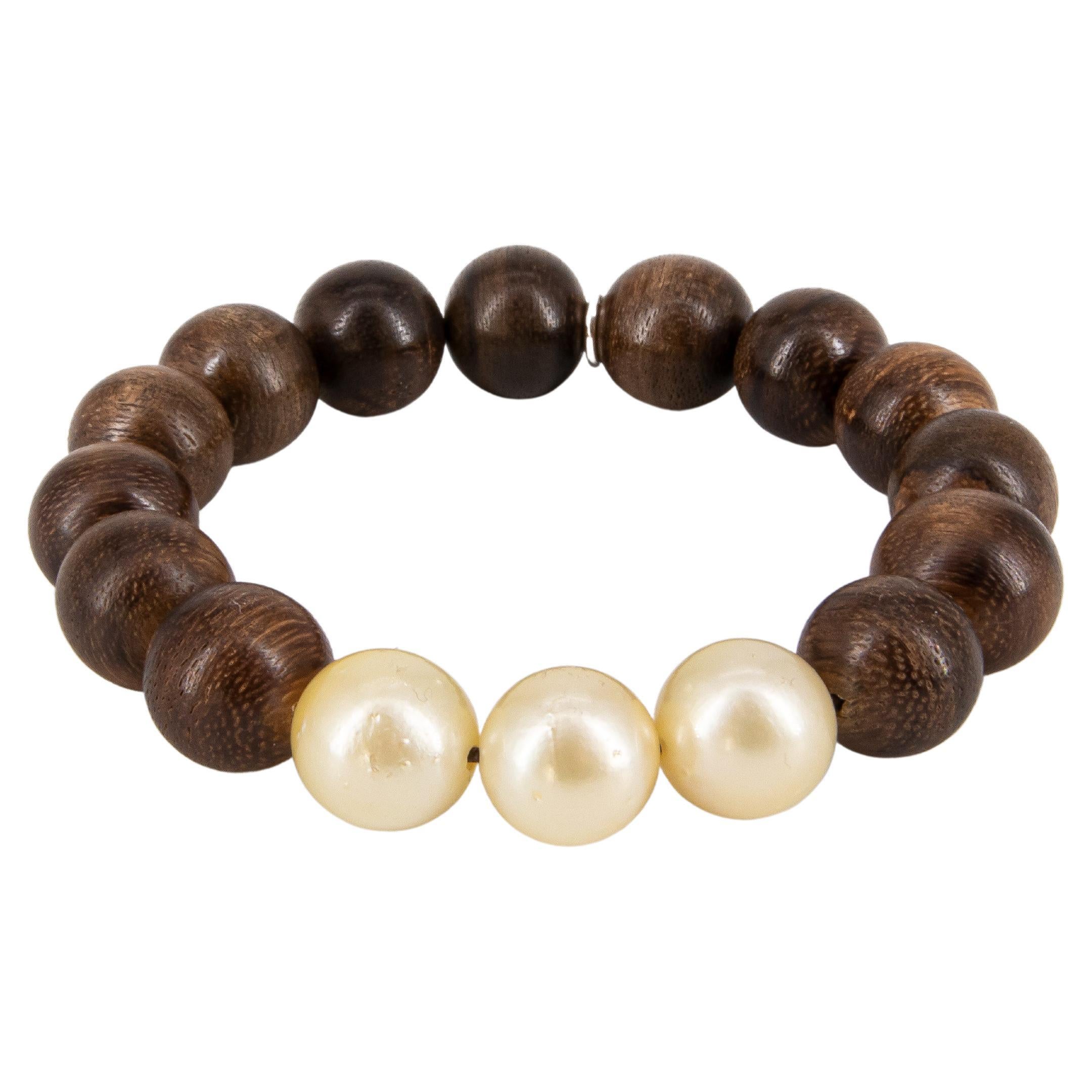 Ebony beads bracelet with 3 big Golden South Sea pearls For Sale