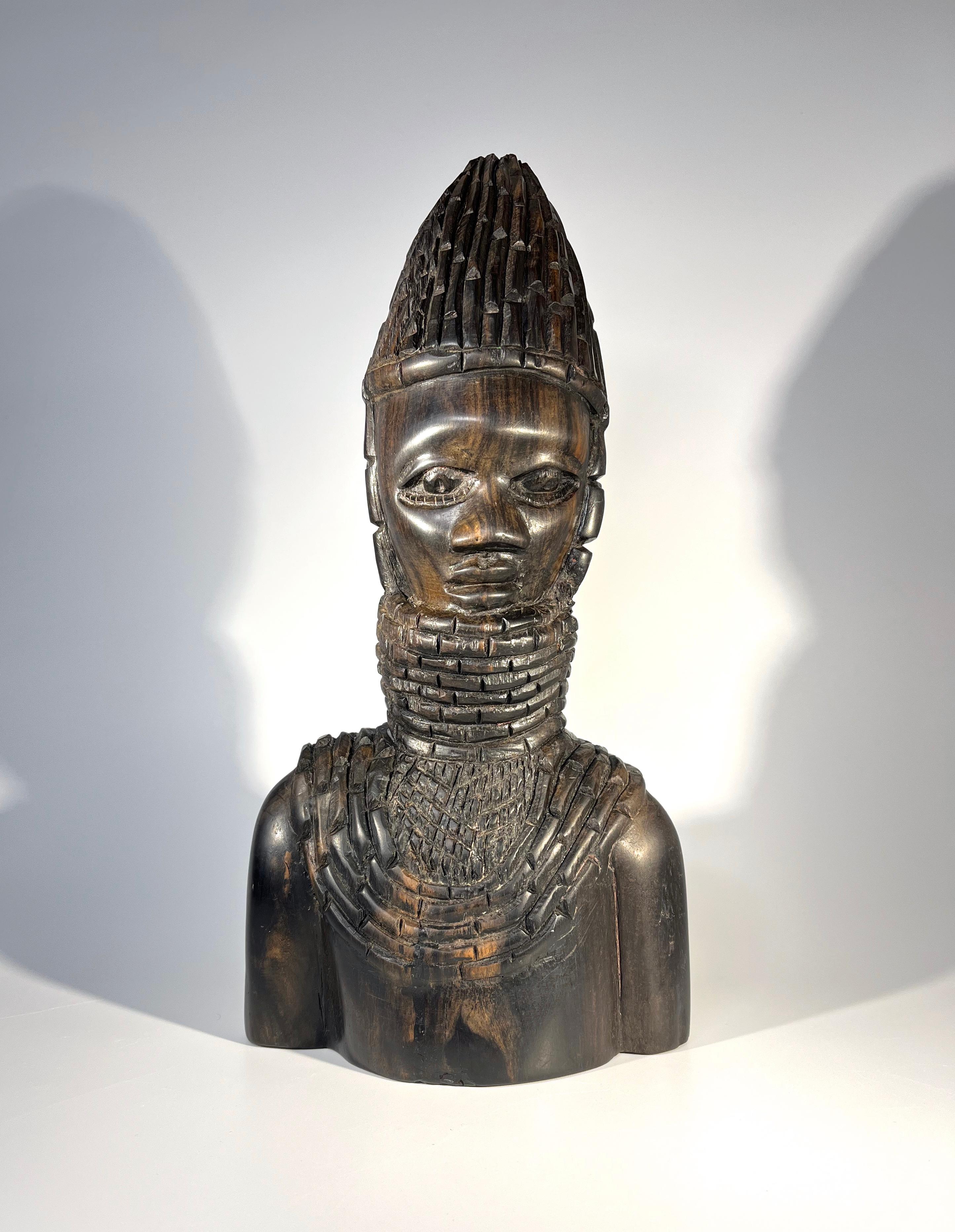 Hand carved ebony hardwood bust of a young Benin warrior
Traditionally carved Benin artistry
Circa 1970
Height 10.75 inch, Width 5.5 inch, Depth 2.75 inch
Very good condition
Wear consistent with age and use