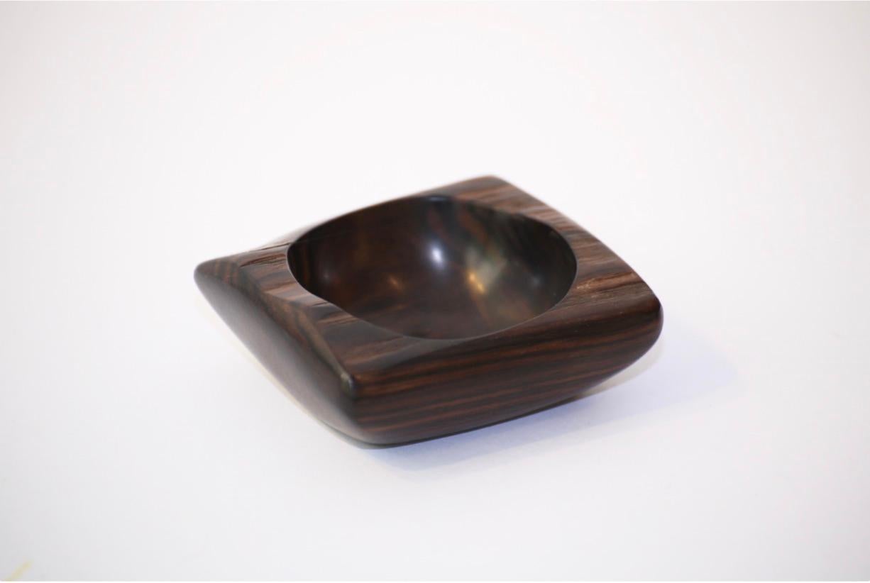 A bowl by Odile Noll:

1. 'Coupe', Ebony, 4 x 9 x 8 cm.
 