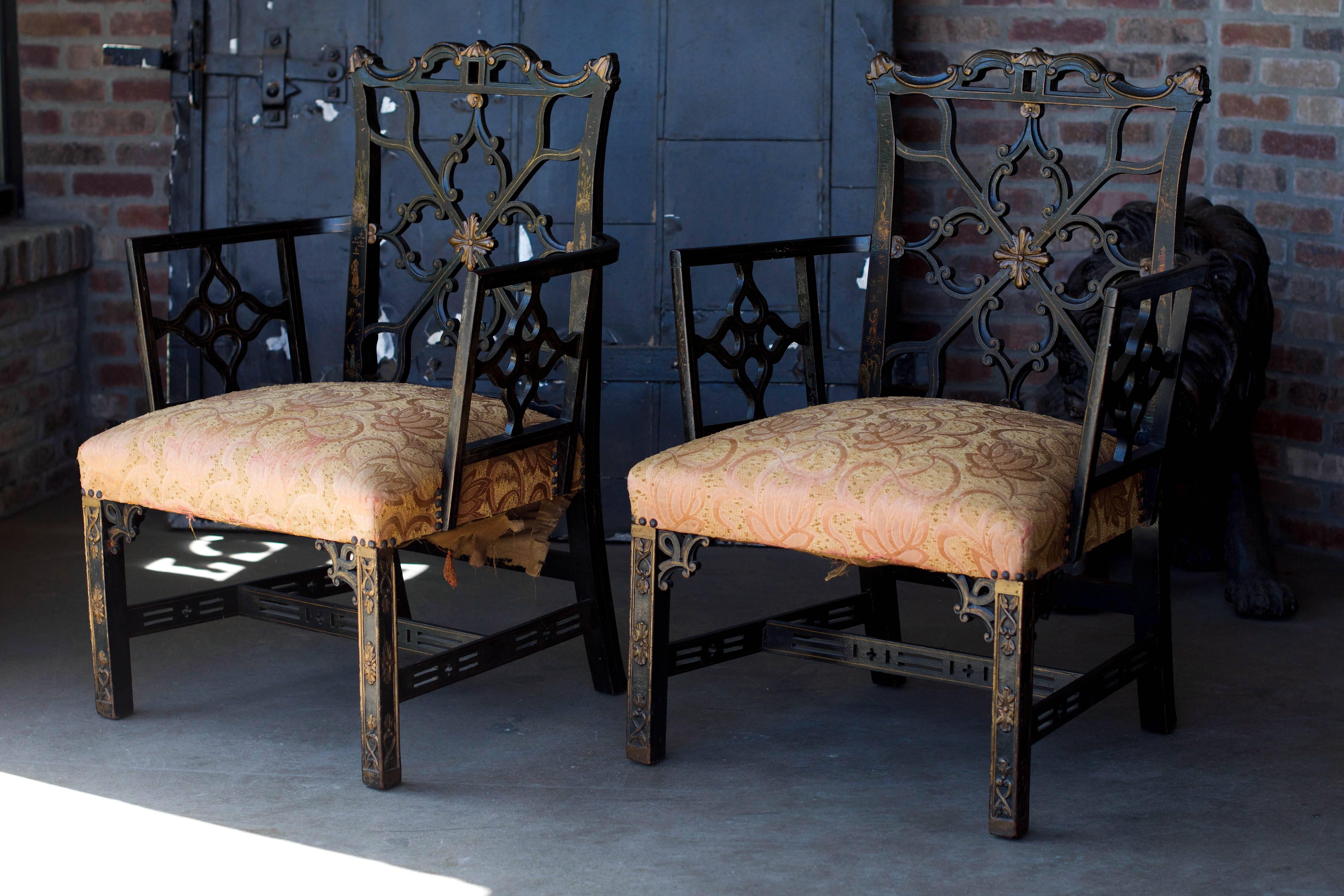 Finely carved ebonized chairs in the English Chippendale tradition. Original black lacquer with gilding and hand-painted chinoiserie details, 19th century. Sold as a pair.