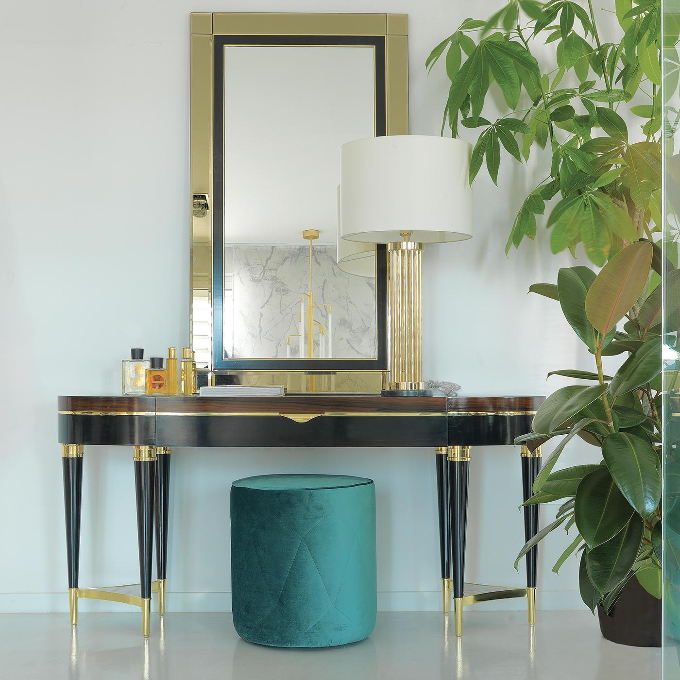 Part of a collection of exquisite furniture pieces made of ebony and boasting a bold character and timeless sophistication, this console features six legs painted in dark ebony, combined three by three, and connected with an insert in Corteccia