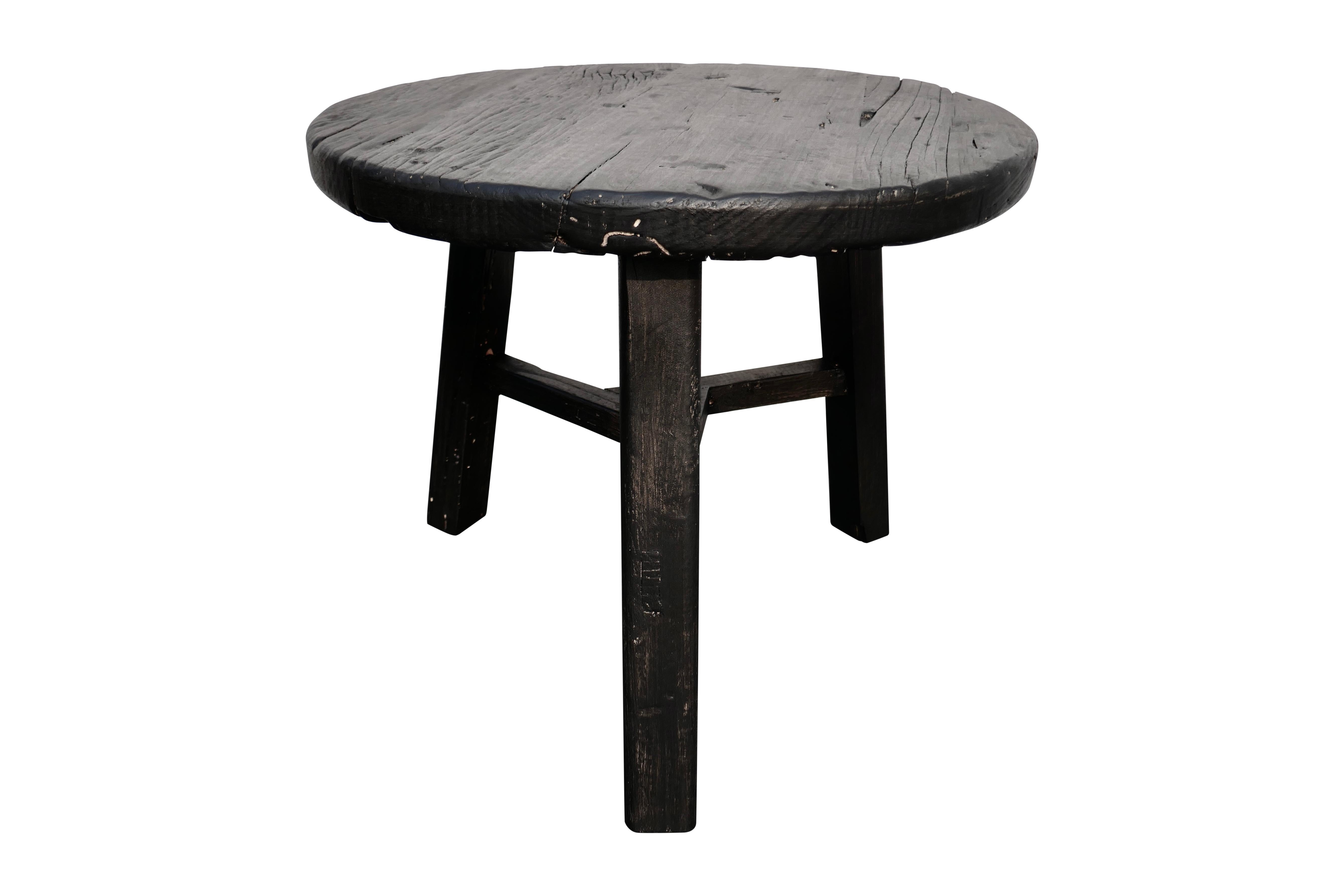 Versatile Asian side table/bench. Freshly hand-built of vintage aged solid heavy elmwood, constructed with mortise & tenon joinery. Showing much desirable natural aged wood characteristics through the lightly distressed ebony finish.