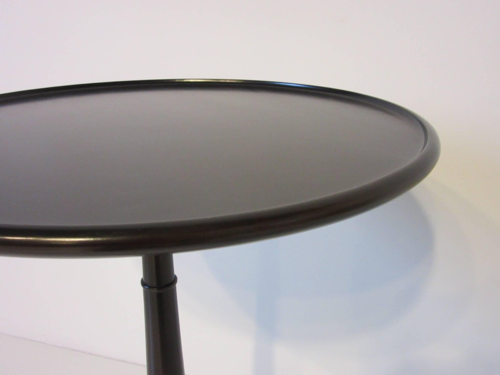 Ebony Finished with Brass Tri Pod Based Midcentury Side Table In Excellent Condition In Cincinnati, OH