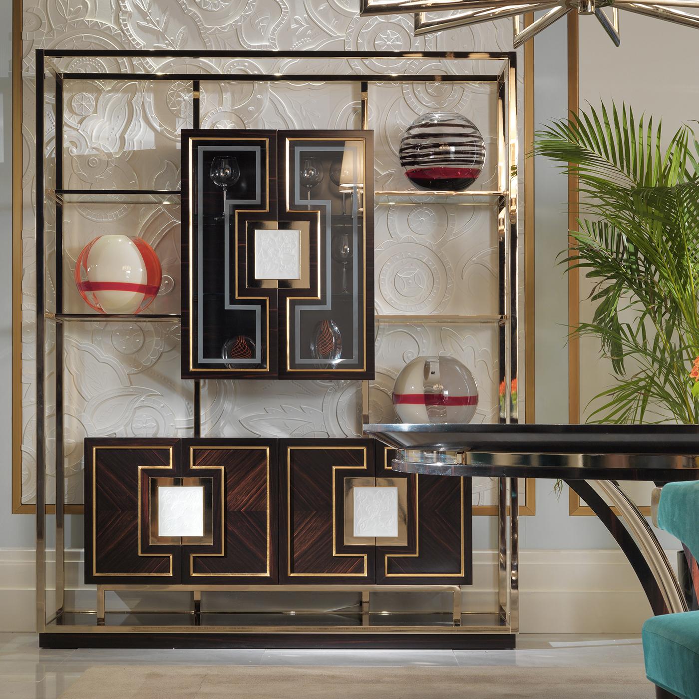 Part of a series of furniture pieces in ebony that boasts impeccable craftsmanship, noble materials, and a bold and unique design, this stunning glass cabinet will be an eye-catching addition to any living room or dining room. The unique silhouette