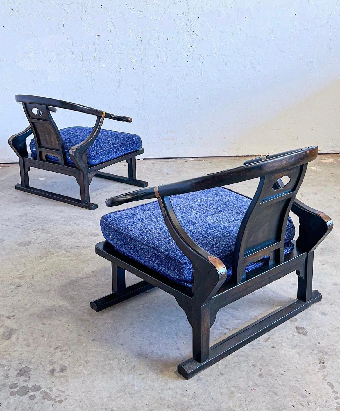Ebony lounge chairs by Micheal Taylor for Baker, Model 2510, signed.

these ebonized walnut loungers are from their far east collection and have been reupholstered in a royal blue with new foam! the frames are structurally sound with patinated