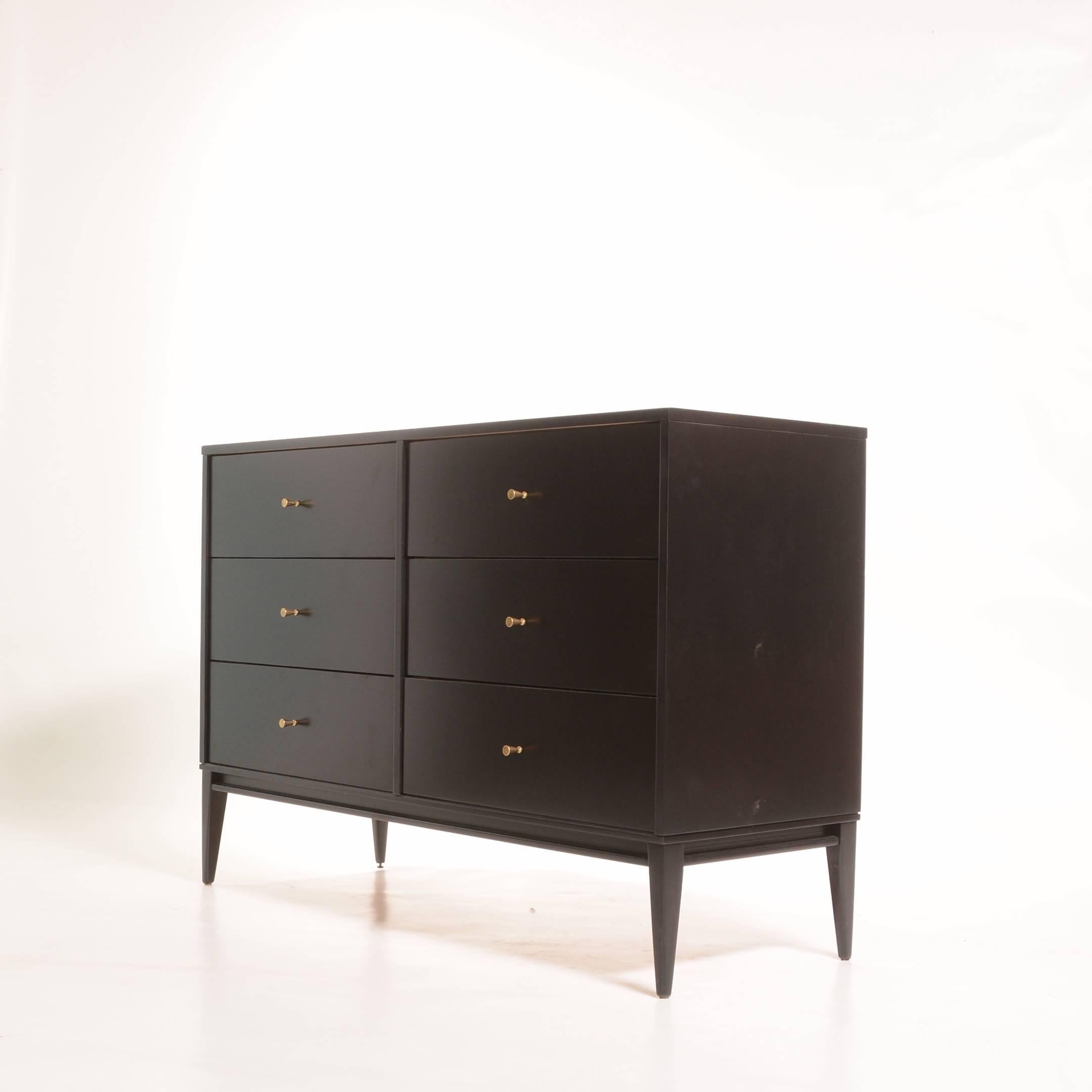 Very beautiful ebonized Paul McCobb six-drawer dresser for Planner Group. This piece has been newly restored and professionally ebonized. We also have the tall glass front topper in stock.
   
