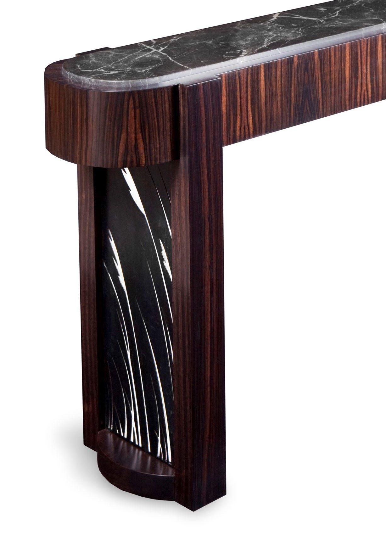 Sea grass console table
Deco influenced console table
Shown in Macassar ebony, blackened steel, and absolute black granite
Customize-able for wood type, stone, and metal
(blackened steel, bronze and stainless steel).

 