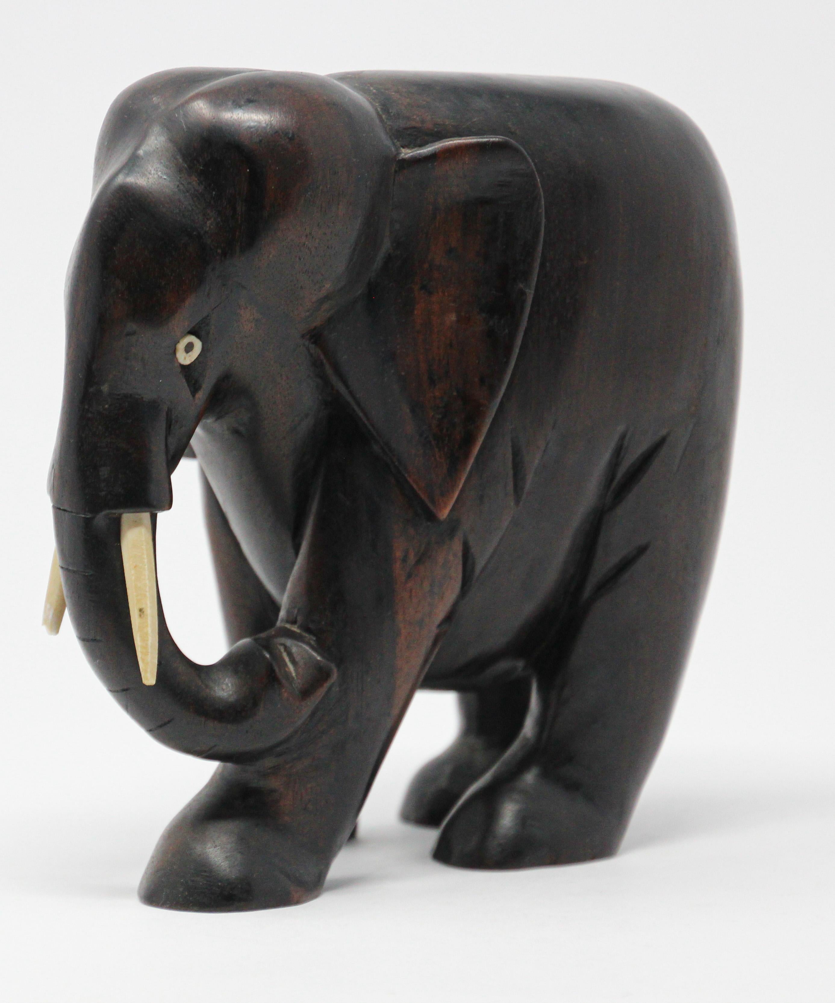 Hand carved wood ebony African elephant.
Handcrafted in Africa.
One of the tusk is damaged