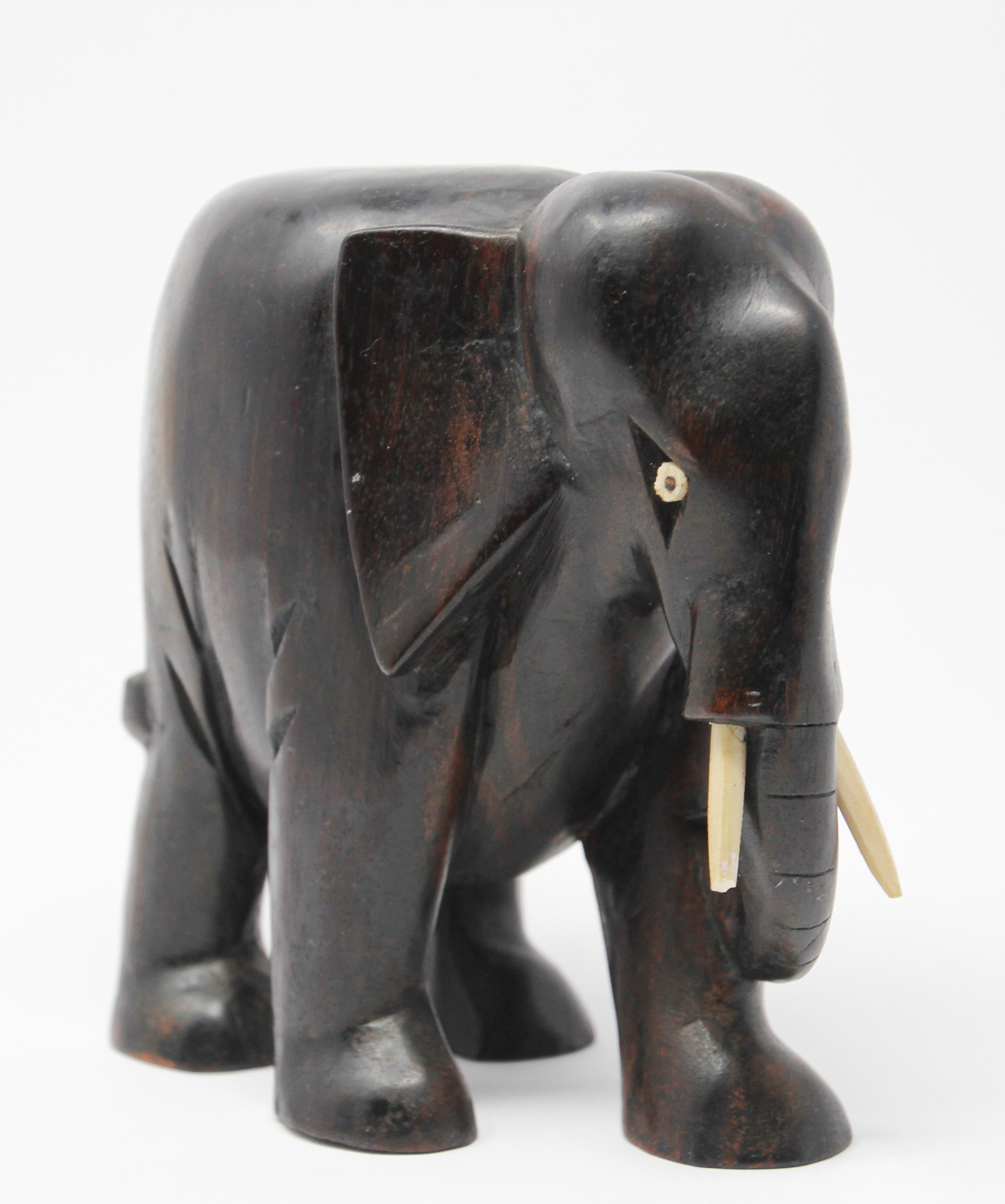 ebony elephant with ivory tusks