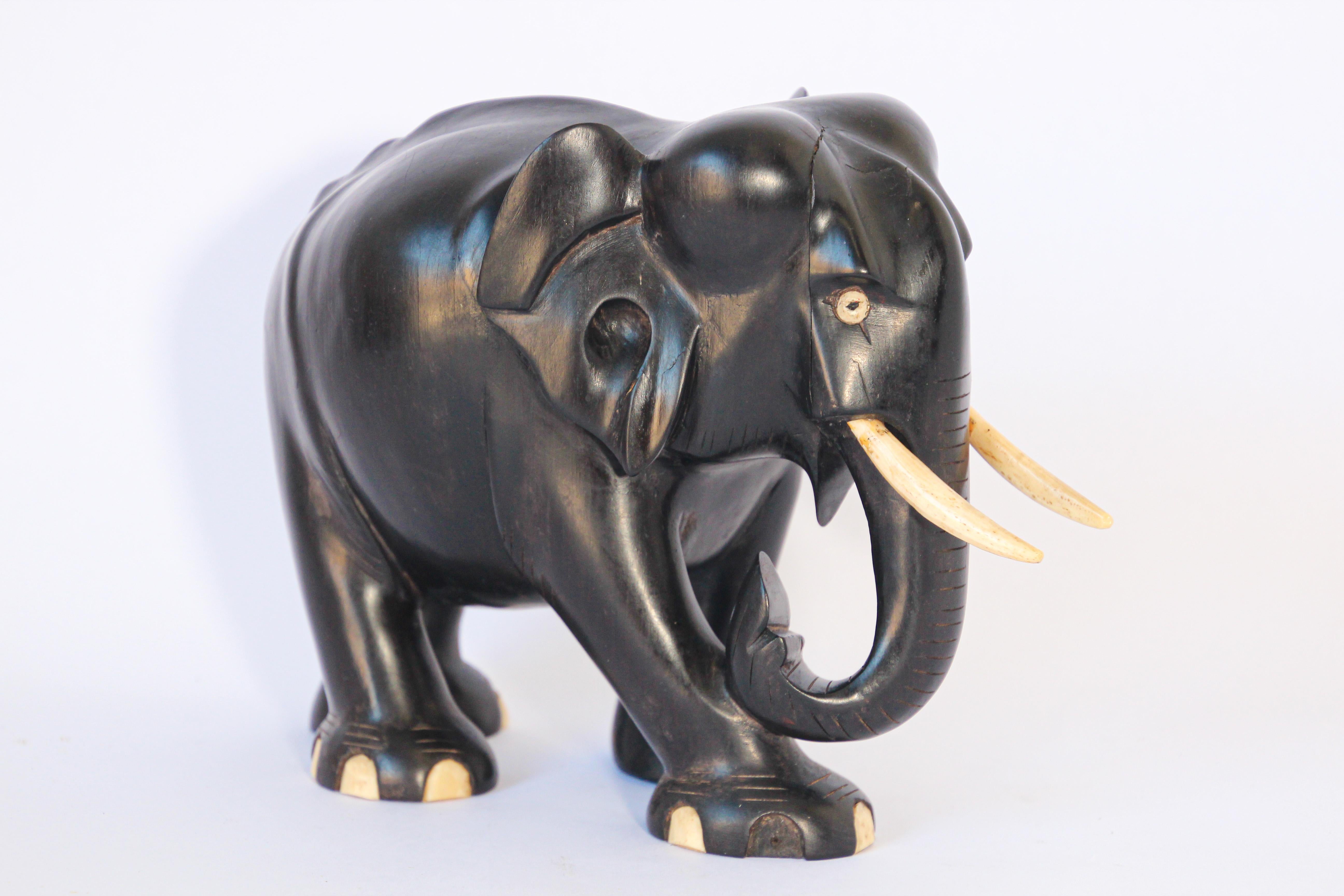 Gorgeous antique large black hand carved wood ebony Anglo-Indian elephant.
This is a large solid ebony wood vintage elephant from Ceylon Sri Lanka.
Hand carved ebony wood lucky elephant.
Art Deco style beautifully hand carved animal sculpture with