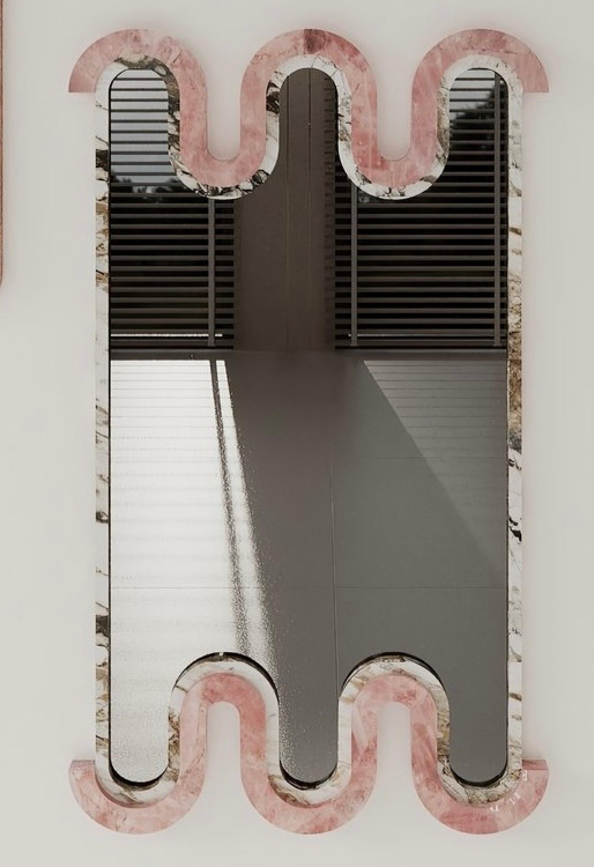 The Ebru Mirror is a sculptural design that blends modern curves with classic elegance, offering a timeless presence in any space. Its distinctive two-tone stonework creates a sense of balance—soft yet structured—making it a statement piece on its