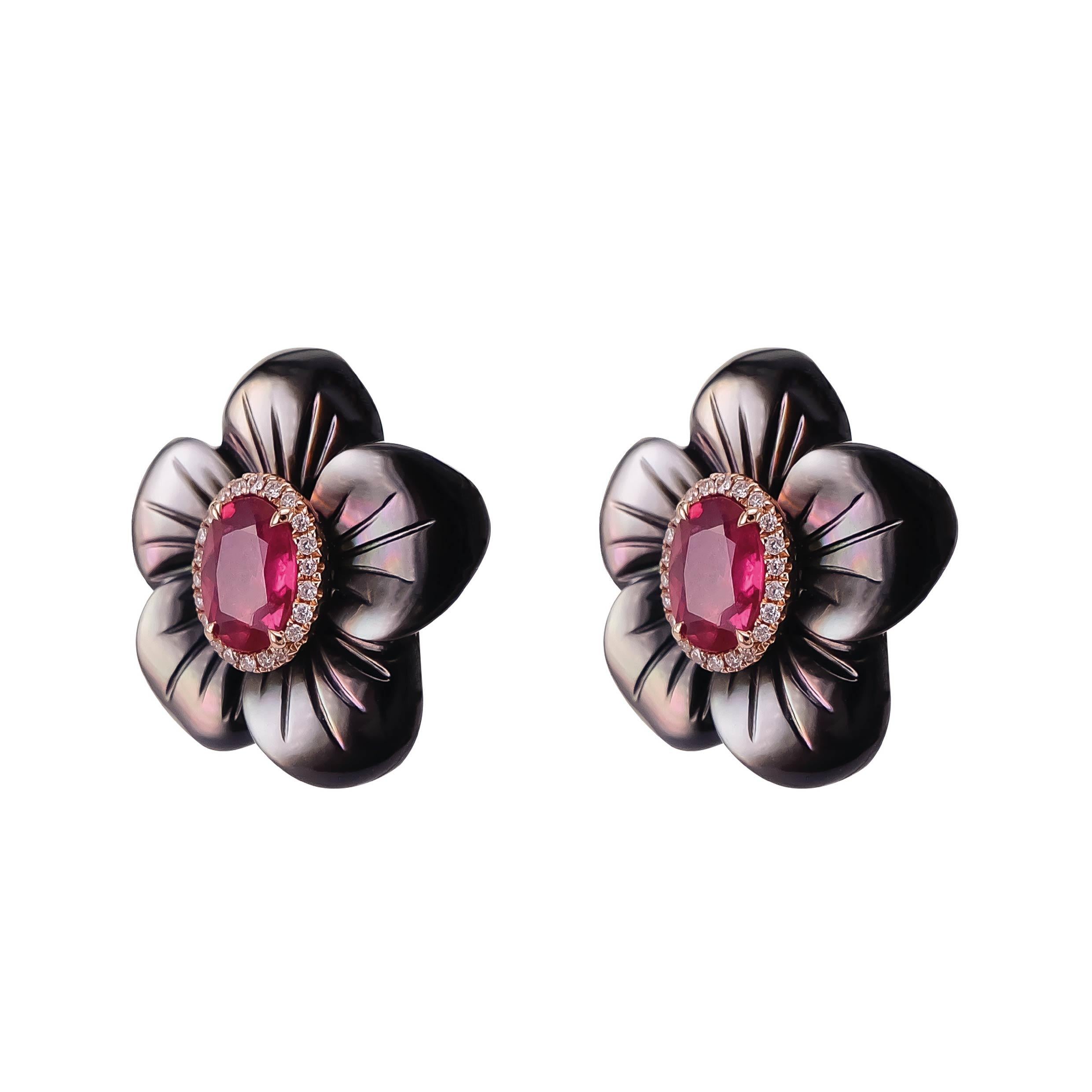 A mix of 1.73 carats of vivid red ruby from Mozambique is set along with 22.12 carats of Black Mother of Pearl. The earring is accented with 0.13 carats of white brilliant diamond.  The details of the earring are mentioned below:
Color: F
Clarity :