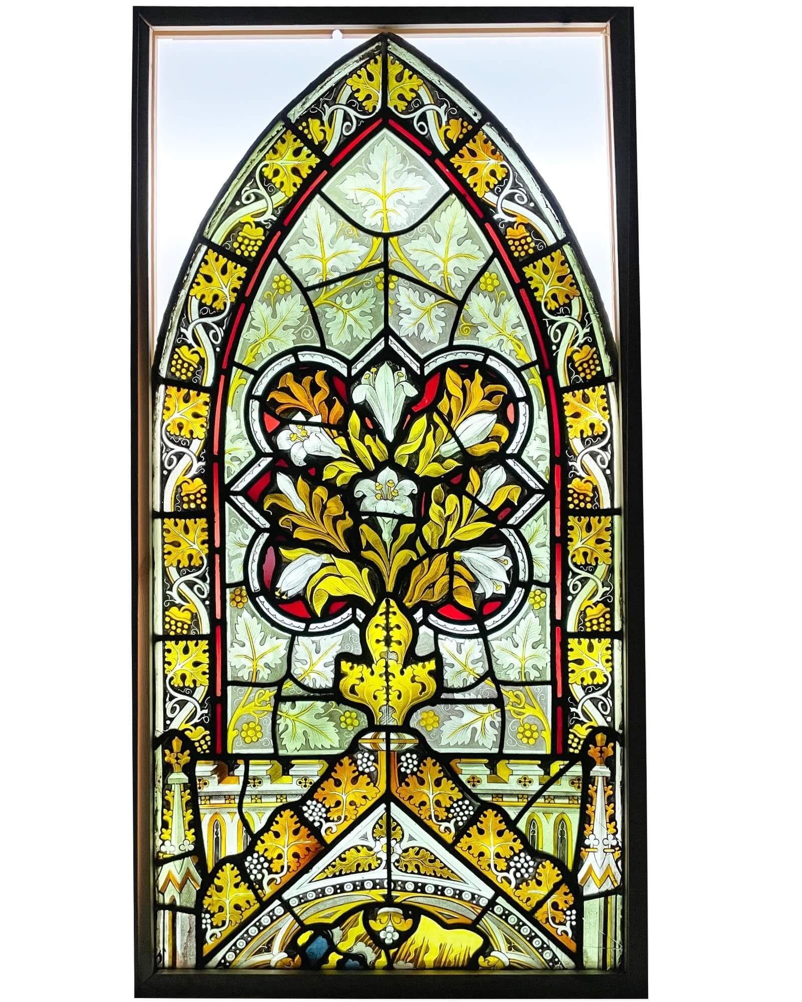 A 19th century Victorian ecclesiastical style arched window attributed to Ward & Hughes, London. This English stained glass is of excellent artistry, each tiny detail hand painted with vibrant colours and character by its late 19th century