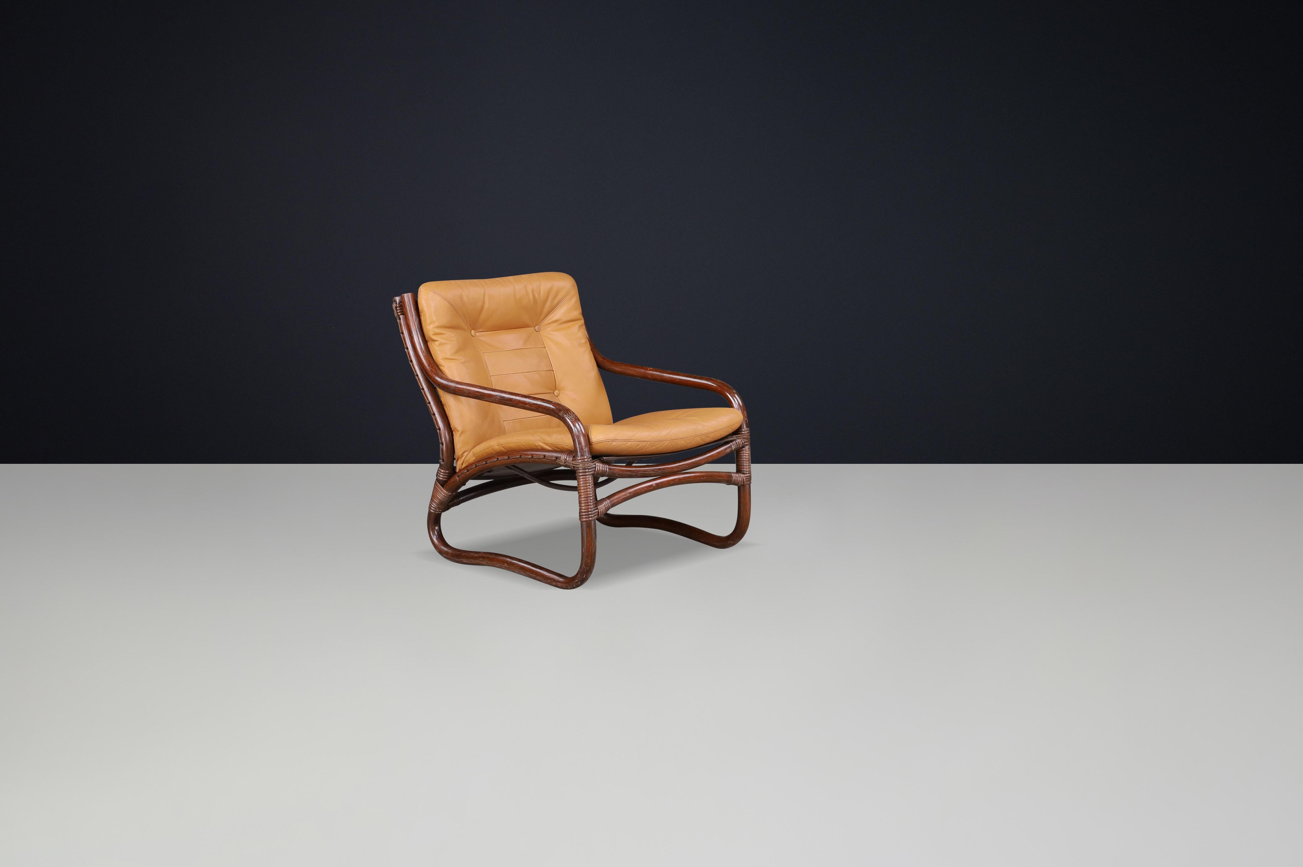 “Ecco” Easy Chair by Slettvoll in Cognac Leather and Patinated Rattan, Norway, 1970s

This rare “Ecco” easy chair from the Korggrupp series by Slettvoll Manilla Furniture, produced in Stranda, Norway during the 1970s, is a stunning example of