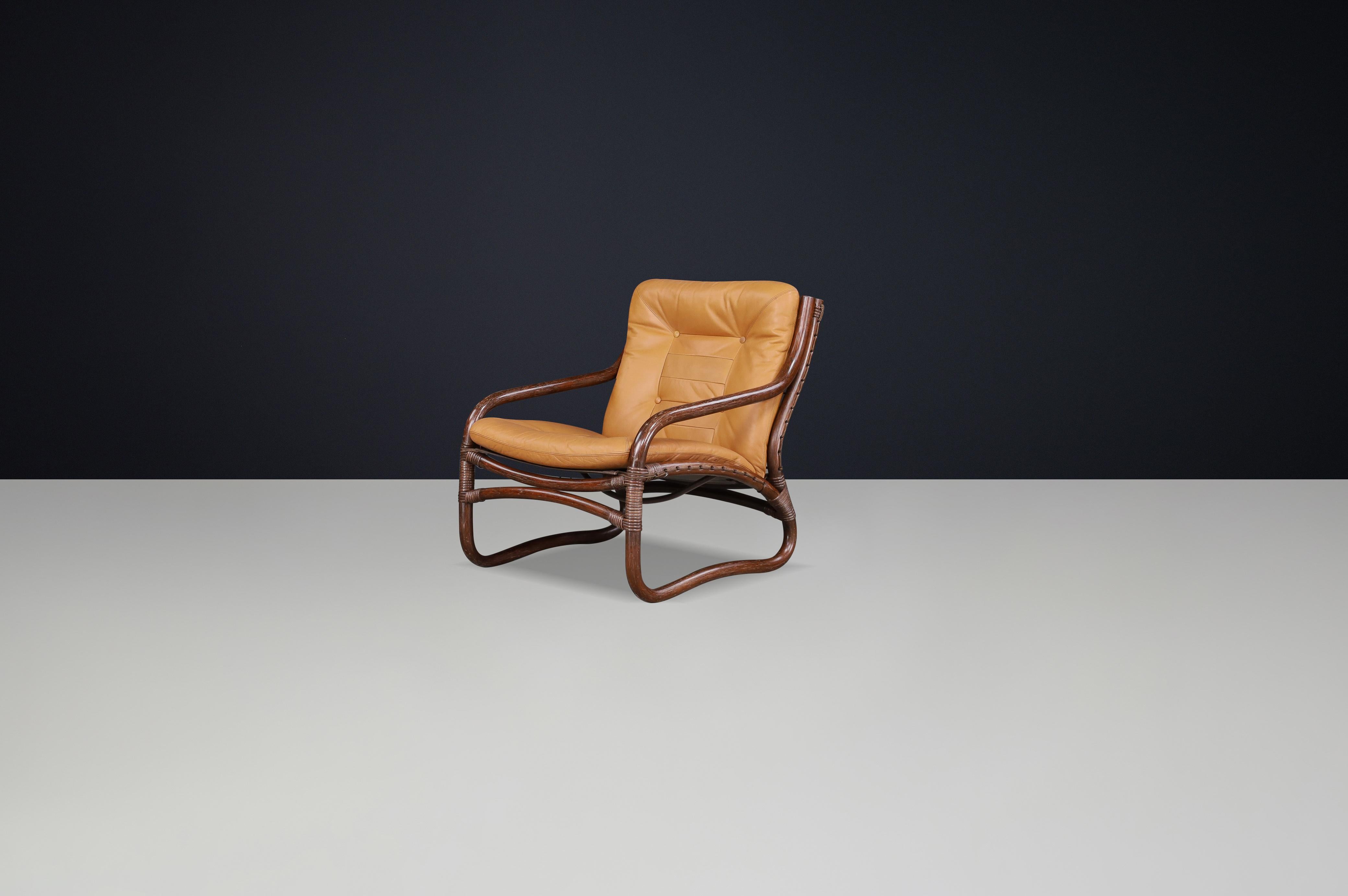 Norwegian “Ecco” Easy Chair by Slettvoll in Cognac Leather and Rattan, Norway 1970s For Sale