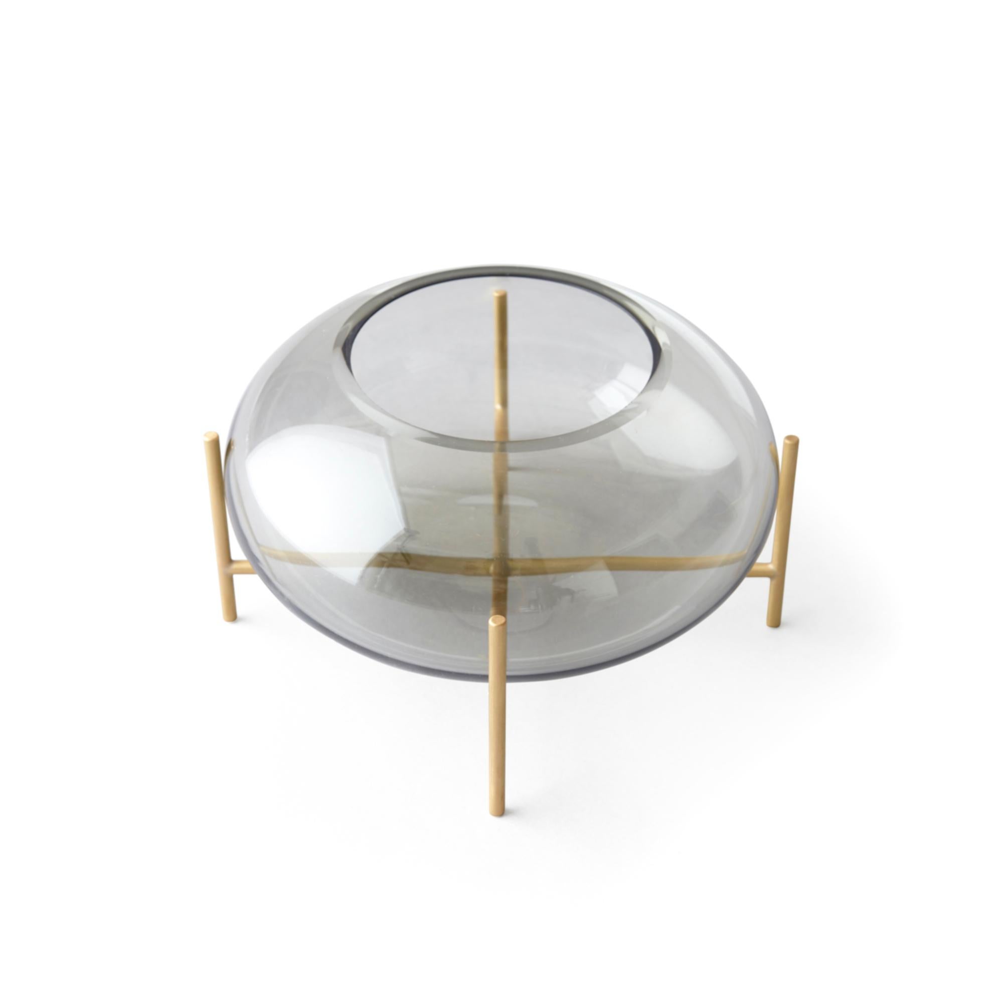 A new addition to the Echasse series by Theresa Arns for Menu, Echasse bowl combines the elegance of a traditional glass bowl with a playful and light expression, created by four slender brass legs that elevate it into the air. The word échasse is