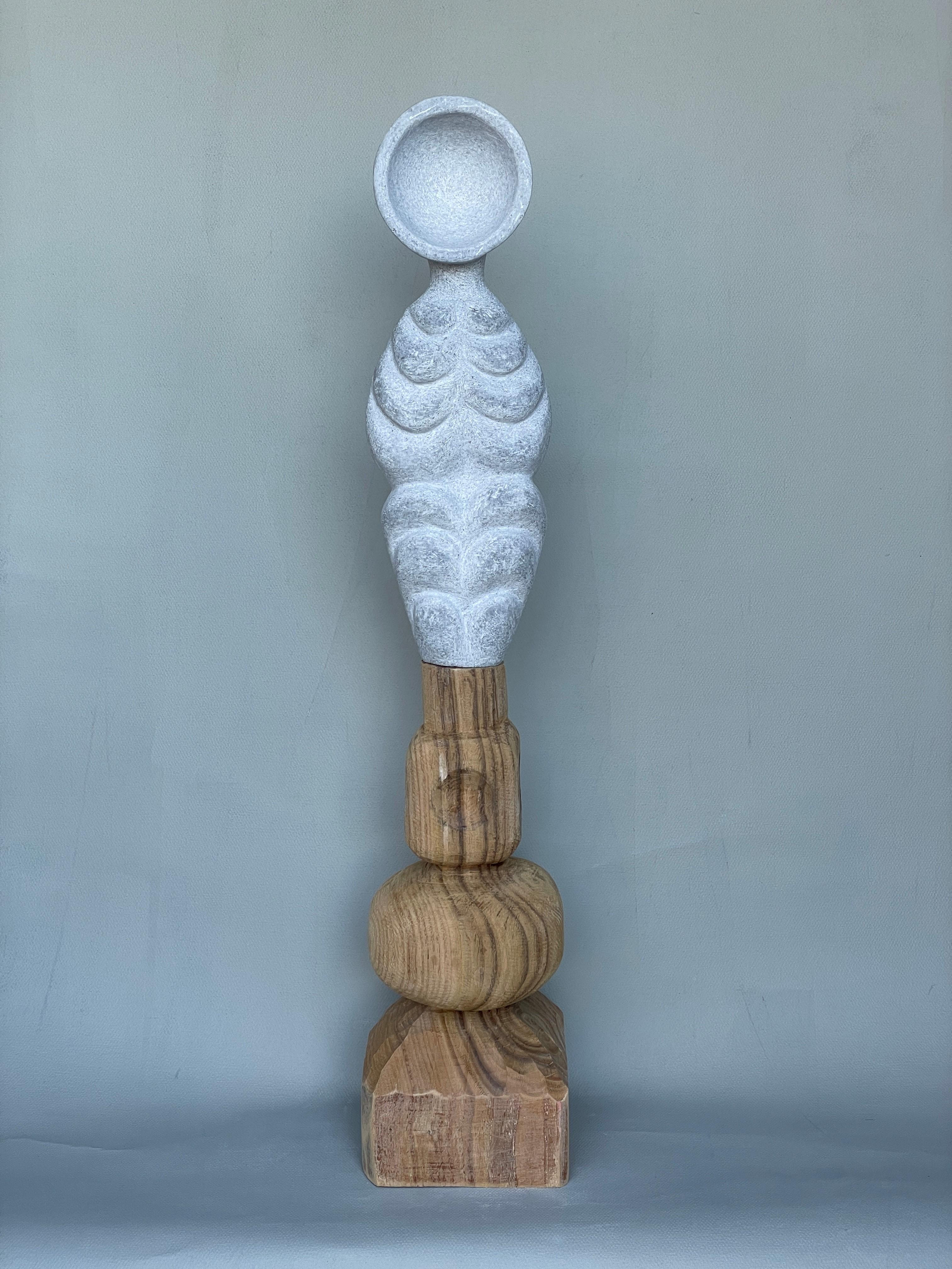 Echo on wood hand carved marble sculpture by Tom Von Kaenel.
Dimensions: D 15 x W 15 x H 76 cm.
Materials: marble, wood

Tom von Kaenel, sculptor and painter, was born in Switzerland in 1961. Already in his early childhood he was deeply devoted