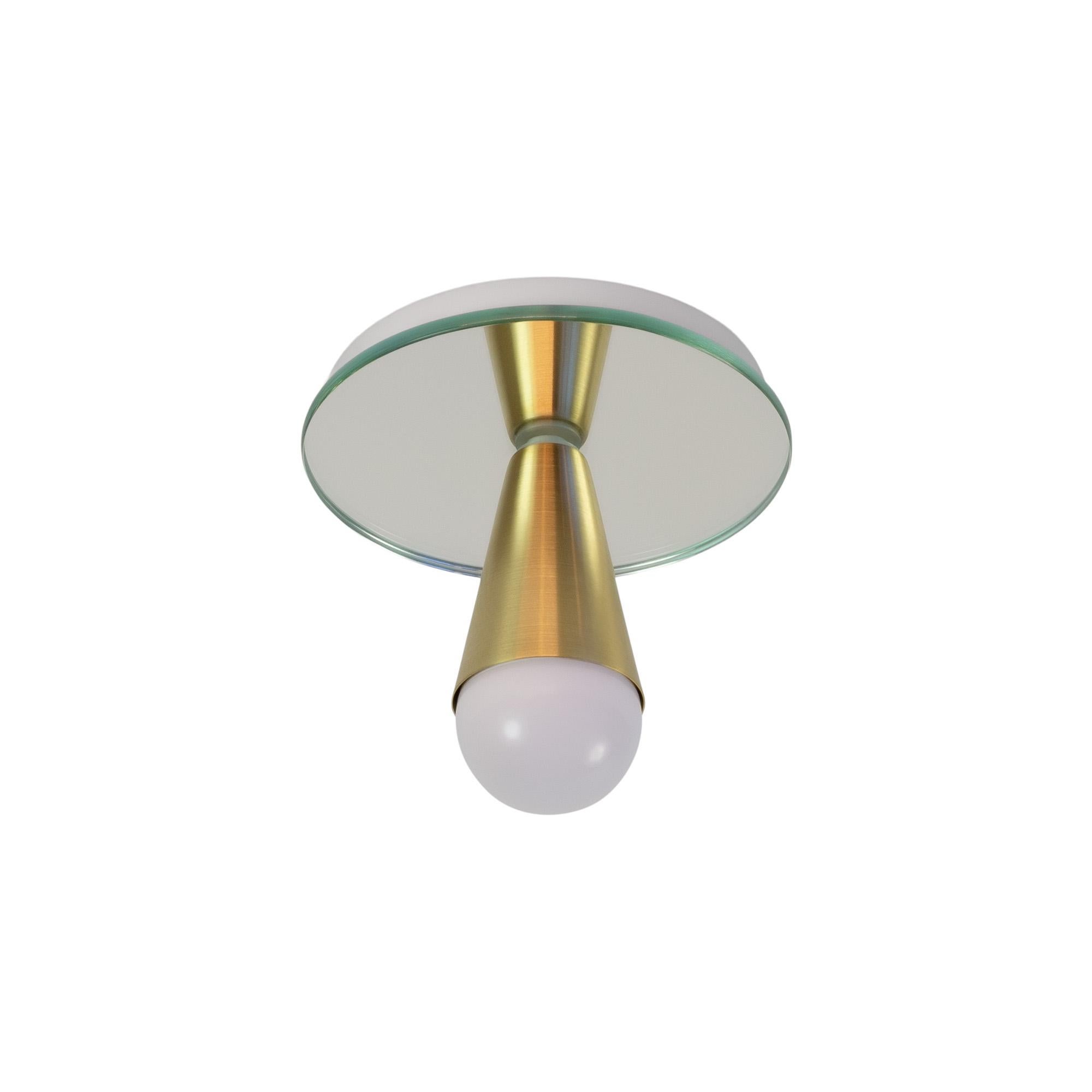 Simple, elegant, and playful, the Echo series is a line of surface-mount fixtures that can be used on a wall or ceiling. White or brass cones mount to mirrored glass to perfectly reflect each bulb, giving the illusion of lights floating in
