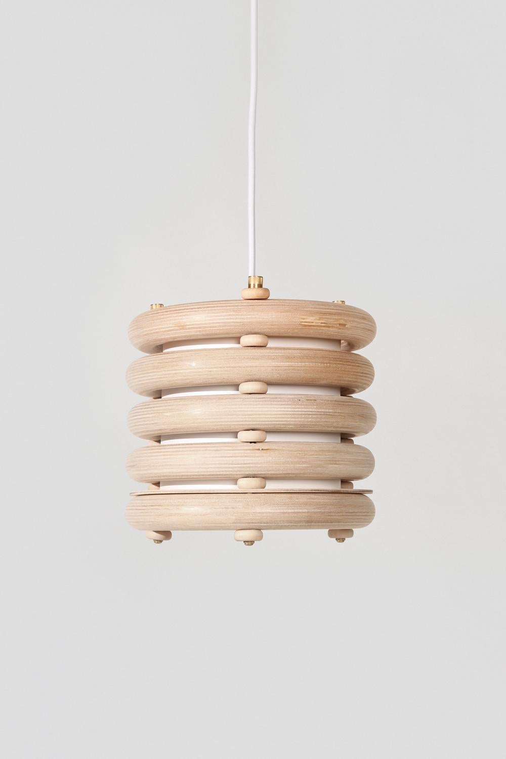 Made to order. Please allow six weeks for production.

The Echo pendant light pairs tropical warmth with minimalist appeal. Made of stacked finely finished birch, the hanging light has an architectural rigidity and a soft visual appeal. Works with