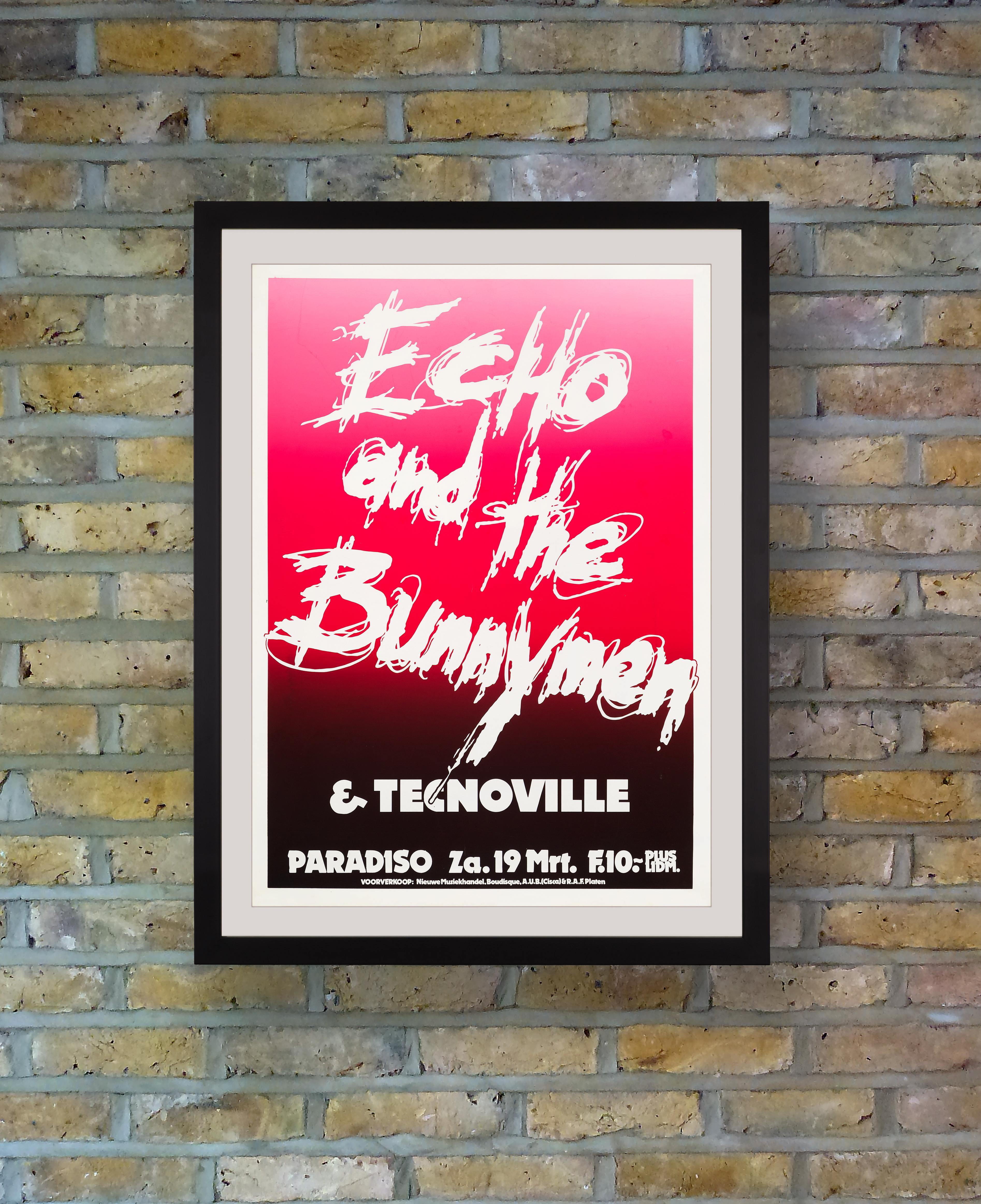 Boldly silkscreen printed in vibrant pink and red inks, this graphic concert poster promoted a performance by Echo & the Bunnymen at the Paradiso Club in Amsterdam on 19th March 1983, during the European leg of their Porcupine Tour. Formed in 1978,