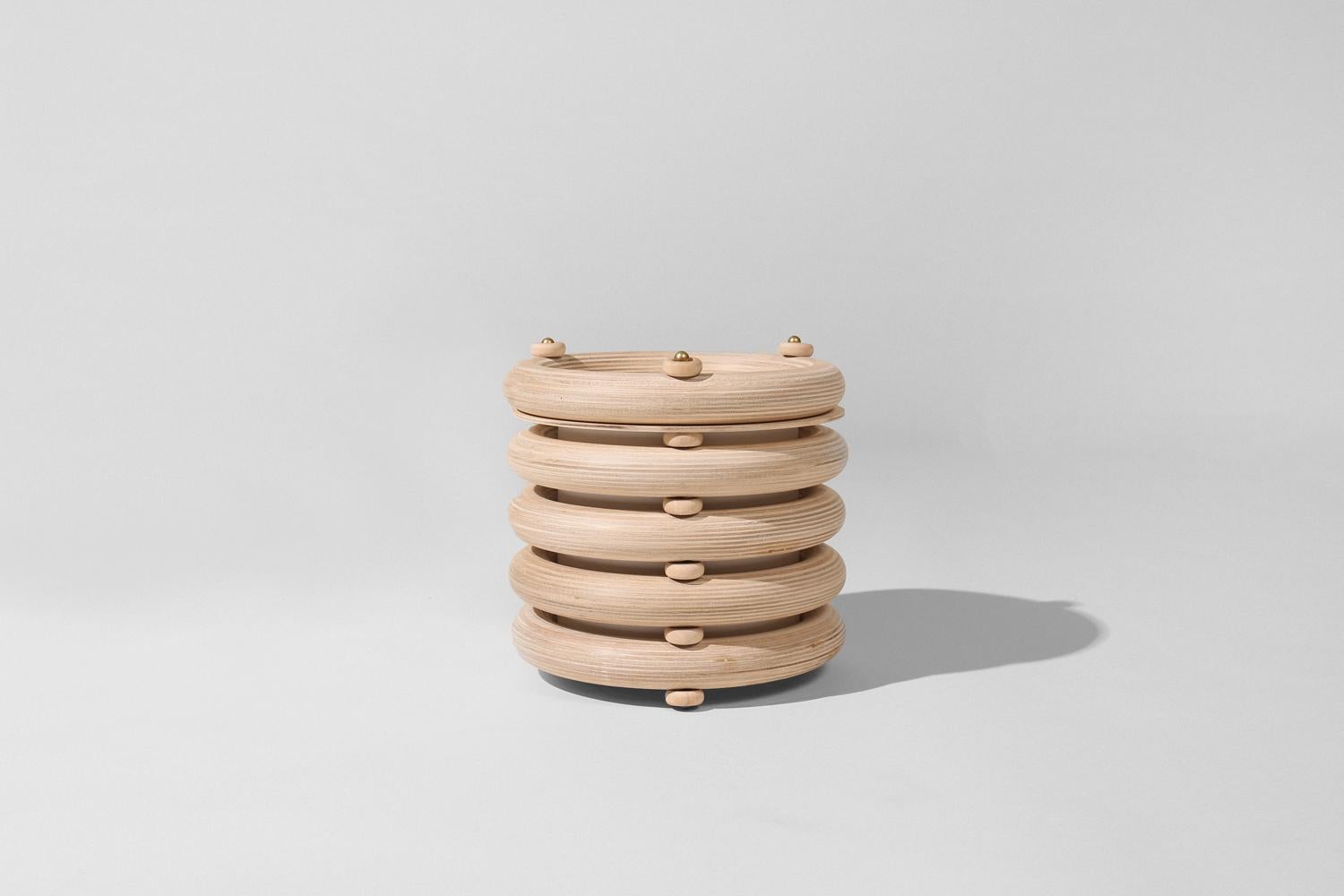 The Echo family of sculptural totems pairs tropical warmth with minimalist appeal. Made of stacked finely finished birch, the totems have an architectural rigidity and a soft visual appeal. The Echo Totem lights are the same sculpture as the
