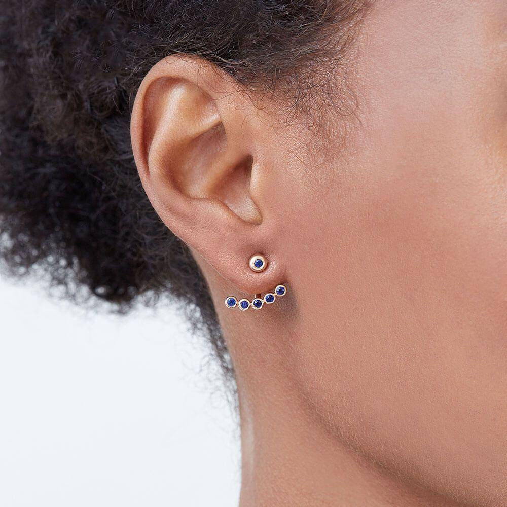 In living colour. Add a pop of colour to your look with these Ecksand Pure Gemstone blue sapphire earrings. These jacket earrings feature a modern design. They are set with dazzling blue sapphire pavé that dangle from the ear. Handcrafted from