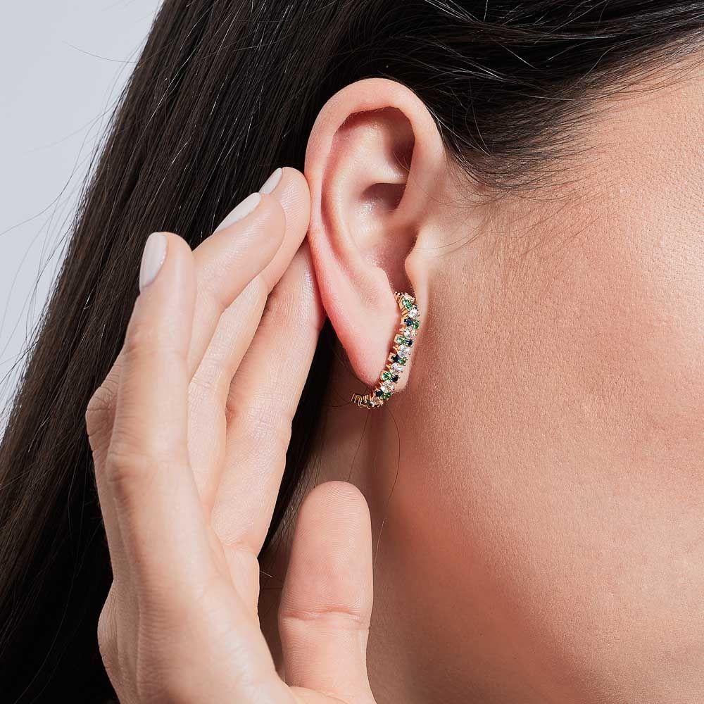 Hours of handcrafting don't go unnoticed in this intricate, one-of-a-kind jewel. Featuring white and blue sapphires alternating with green emeralds, these earrings draw inspiration from nature all around us in a dazzling display of