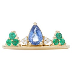 Ecksand 18k Yellow Gold Pear Cut Sapphire Ring with Diamonds and Emeralds