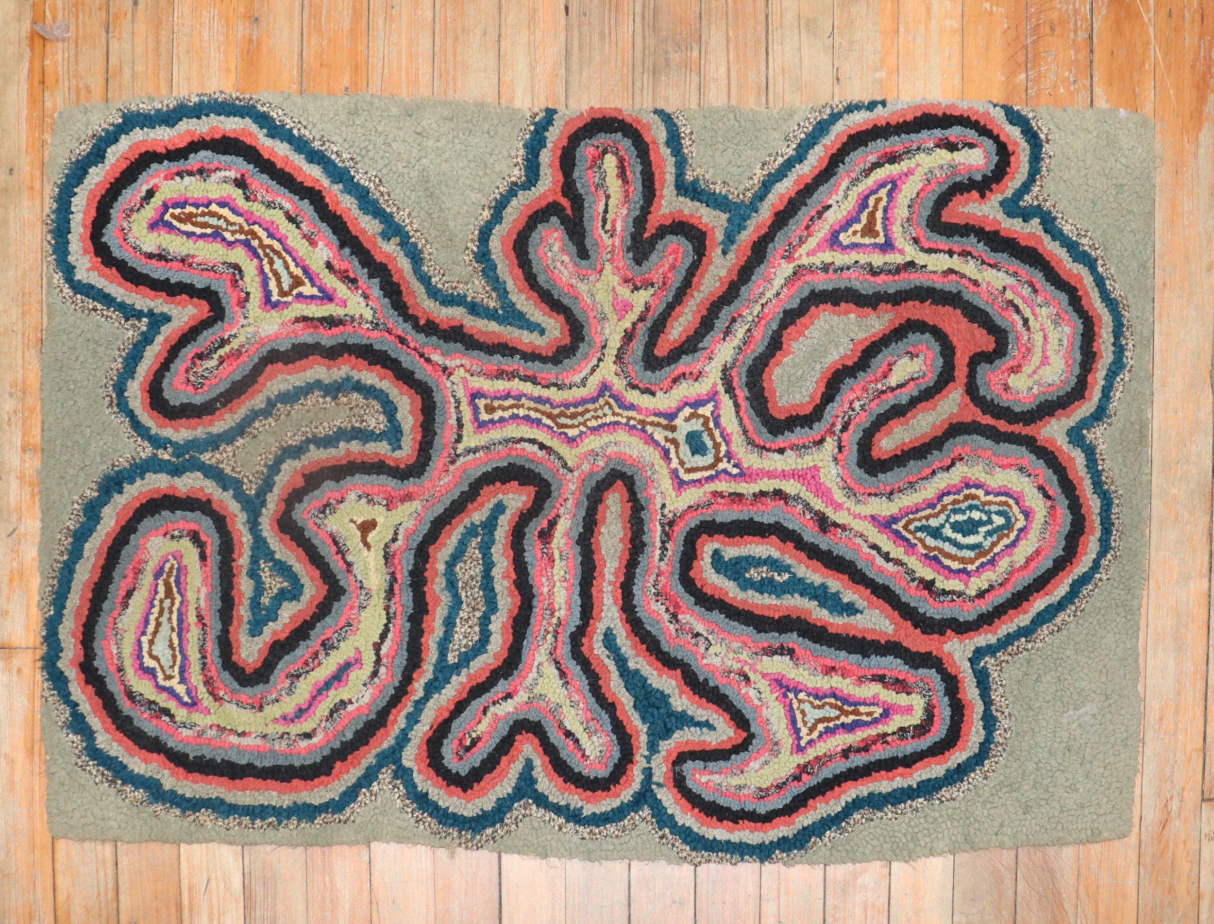 An American Hooked rug from the 3rd quarter of the 20th century with an eclectic design

Measures: 2' x 3'2''.

 