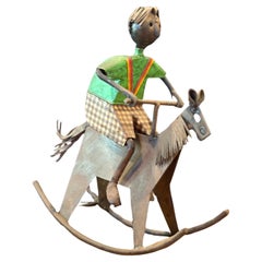 Eclectic Boy on Rocking Horse Painted Metal Sculpture by Luis Felguerez