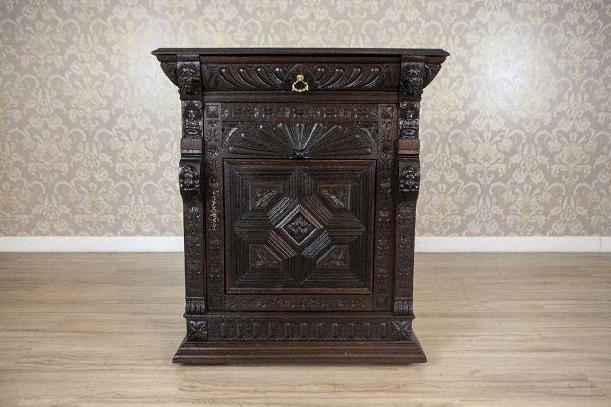 Eclectic Breton-Style Oak Sideboard From the Late 19th Century

This massive piece of furniture, made of solid oak wood, dates to the late 19th century. The sideboard comprises a single-door cabinet with a drawer and rich woodcarving details.
The
