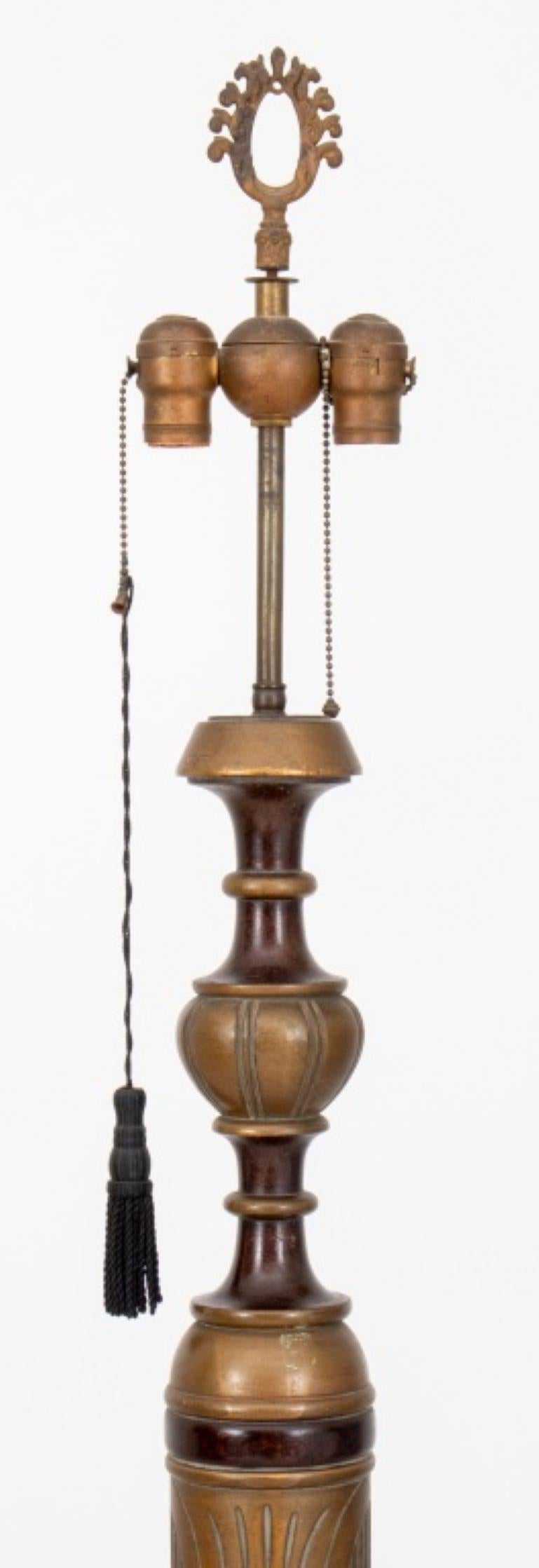 Eclectic Gilded Age floor lamp, circa 1910, with turned and carved ornamentation, parcel gilded and faux bois decorated on molded circular base.