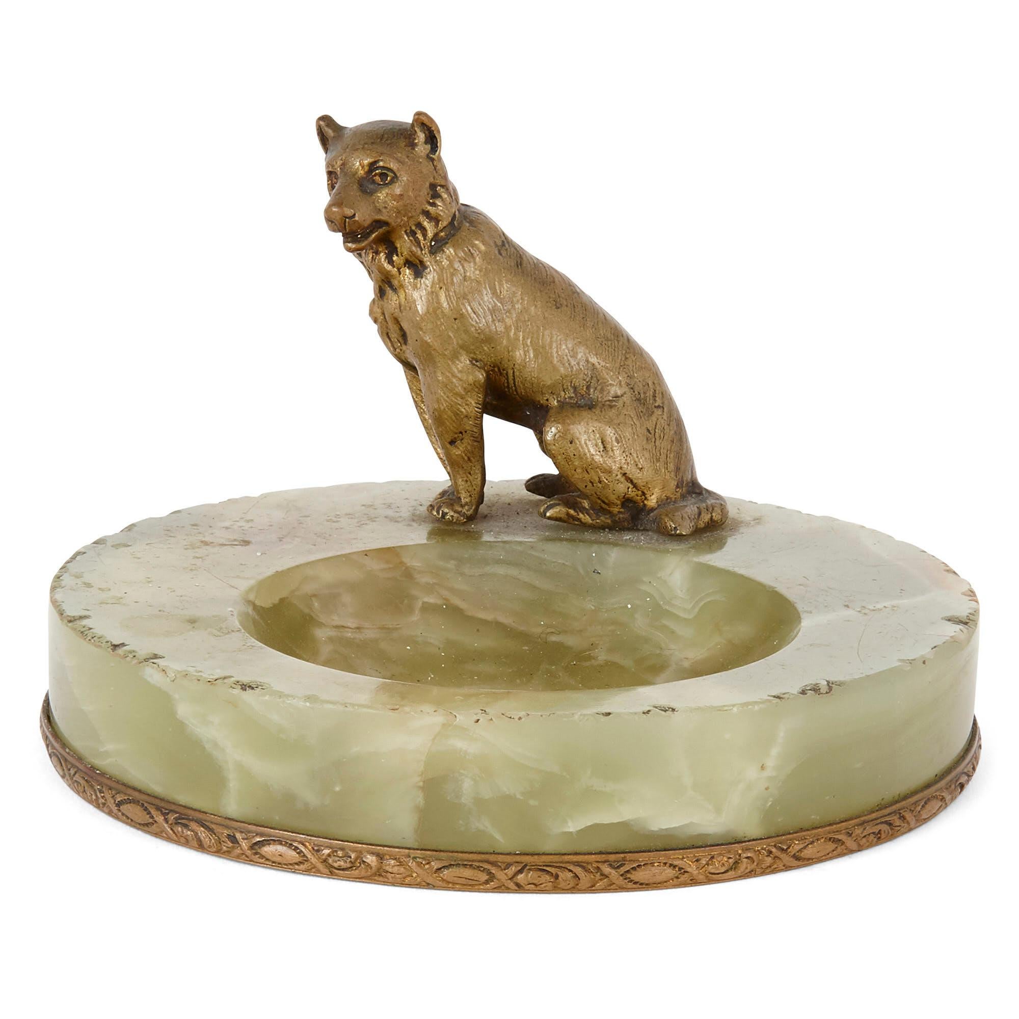 Eclectic group of five antique dog-form objects
Continental, circa 1900
Measures: Largest: 16cm, diameter 12cm
Smallest: Height 4cm, diameter 6cm

This wonderful little collection of dog themed items is comprised of five pieces, a porcelain