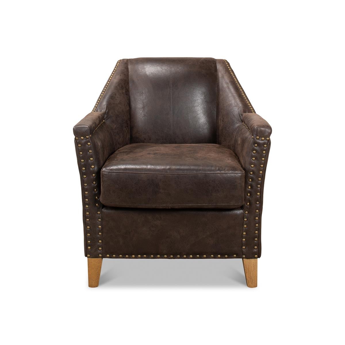 Eclectic Modern leather armchair with a coffee finish antiqued leather, with a+America oak legs and large nailhead trim details.

Dimensions: 28