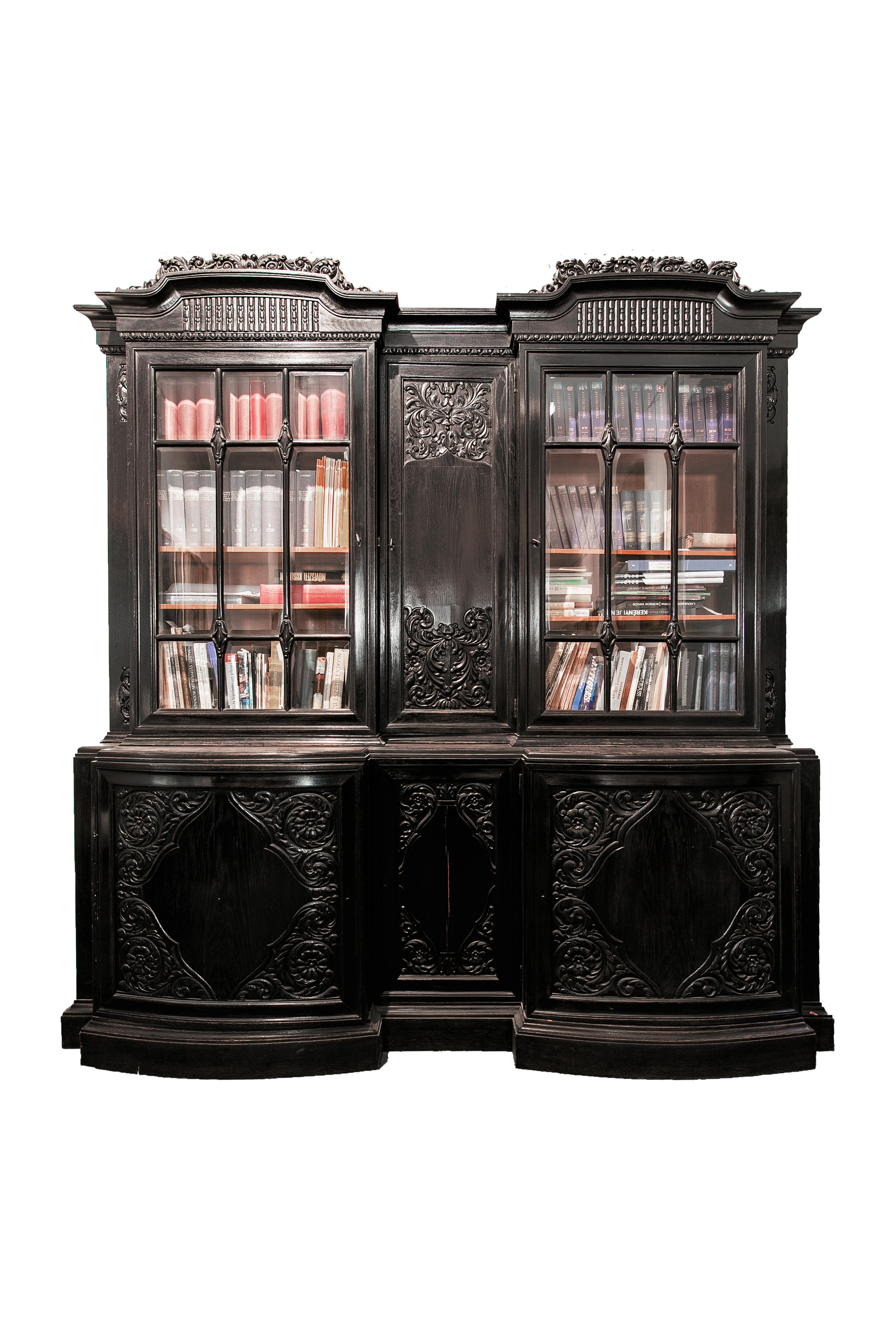 Workingroom ensemble in Eclectic style manufactured around 1920.
Stained black beech in original condition.
The set consists of a bookcase with glass doors, that is supplemented by a desk, a round table and a chair, with the following