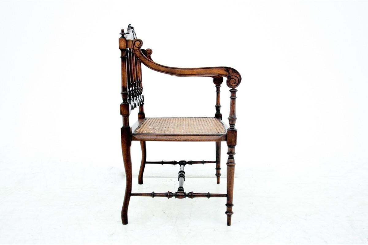 Walnut Eclectic raffia braid armchair, France, circa 1880.