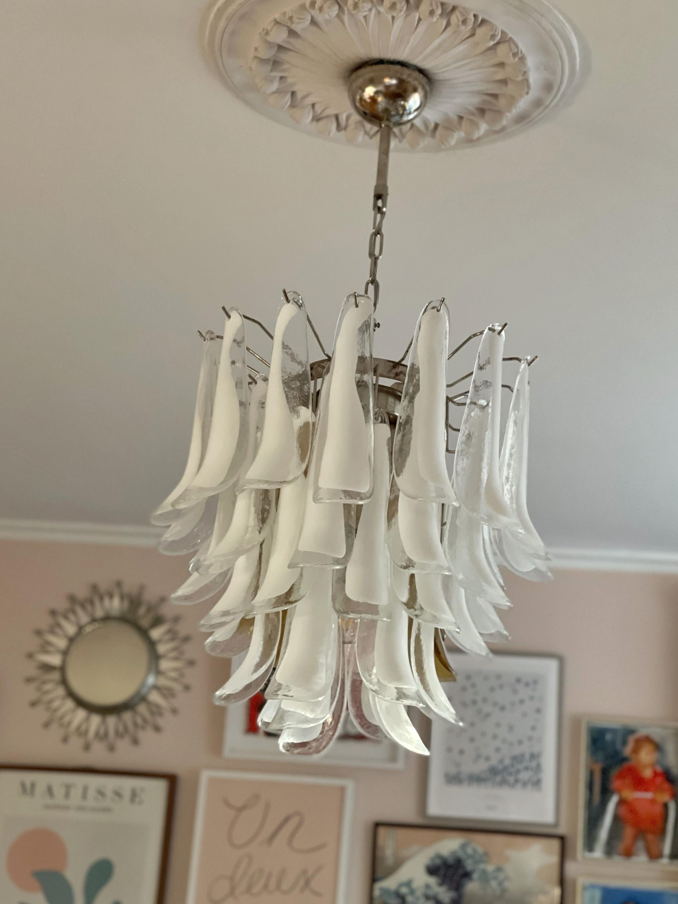 Eclectic Contemporary Murano Chandeliers. Petal Formed Glass Prisms in Traditional Italian Mid-Century Style. The glass petals have swirls in white and clear glass.
The murano fixture is composed of 41 Glass Elements in the size of 29 x8 cm (11.4