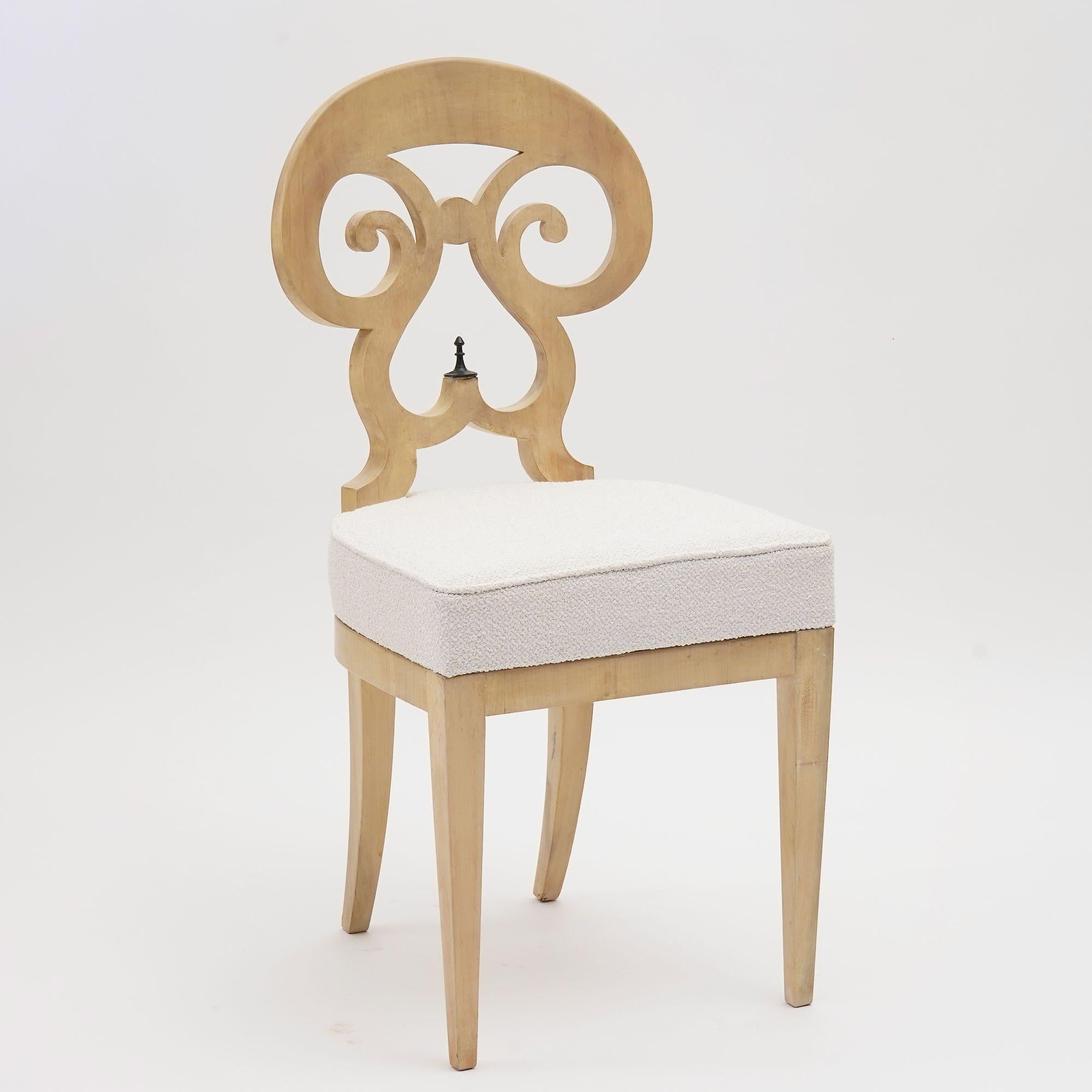 The Eclectica collection is a group of Biedermeier chairs.
This listing offers the model Maria-Theresia. 
Crafted from fine solid Italian walnut, this version features a refined whitewashed Gustavian finish. The effect is achieved using a wood stain