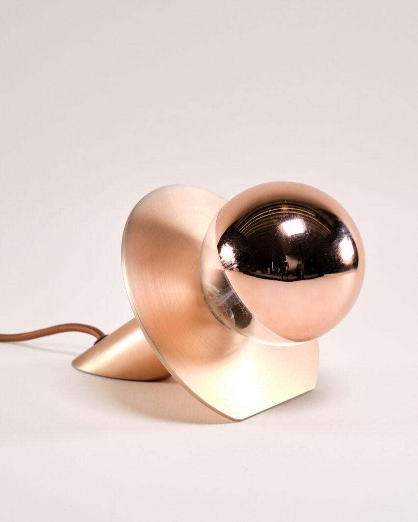 Eclipse Copper Desk Lamp by Carla Baz
Dimensions: D 15 x W 15 x D 11 cm.
Materials: Copper.
Weight: 0,9 kg.

Available in different materials: verdigris metal, copper and stainless steel. Please contact us. 

Inspired by the Sun eclipse, the Eclipse