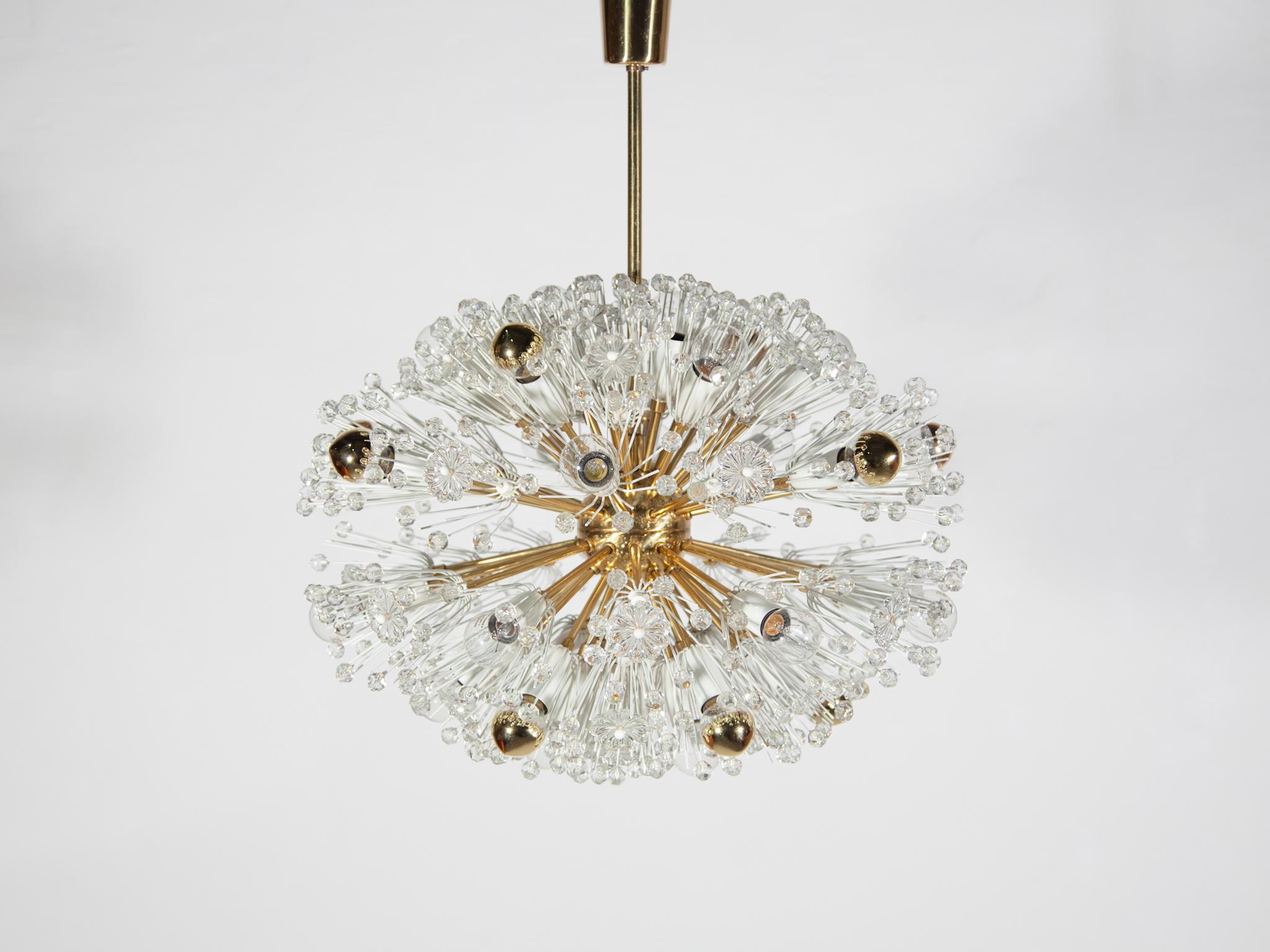 Spectacular, 1950s Emil Stejnar chandelier for Rupert Nikoll, Austria. This sparkling orb is one of the larger versions of this eclips design. The chandelier consists of a brass body and arms with white enameled socket covers each surrounded by