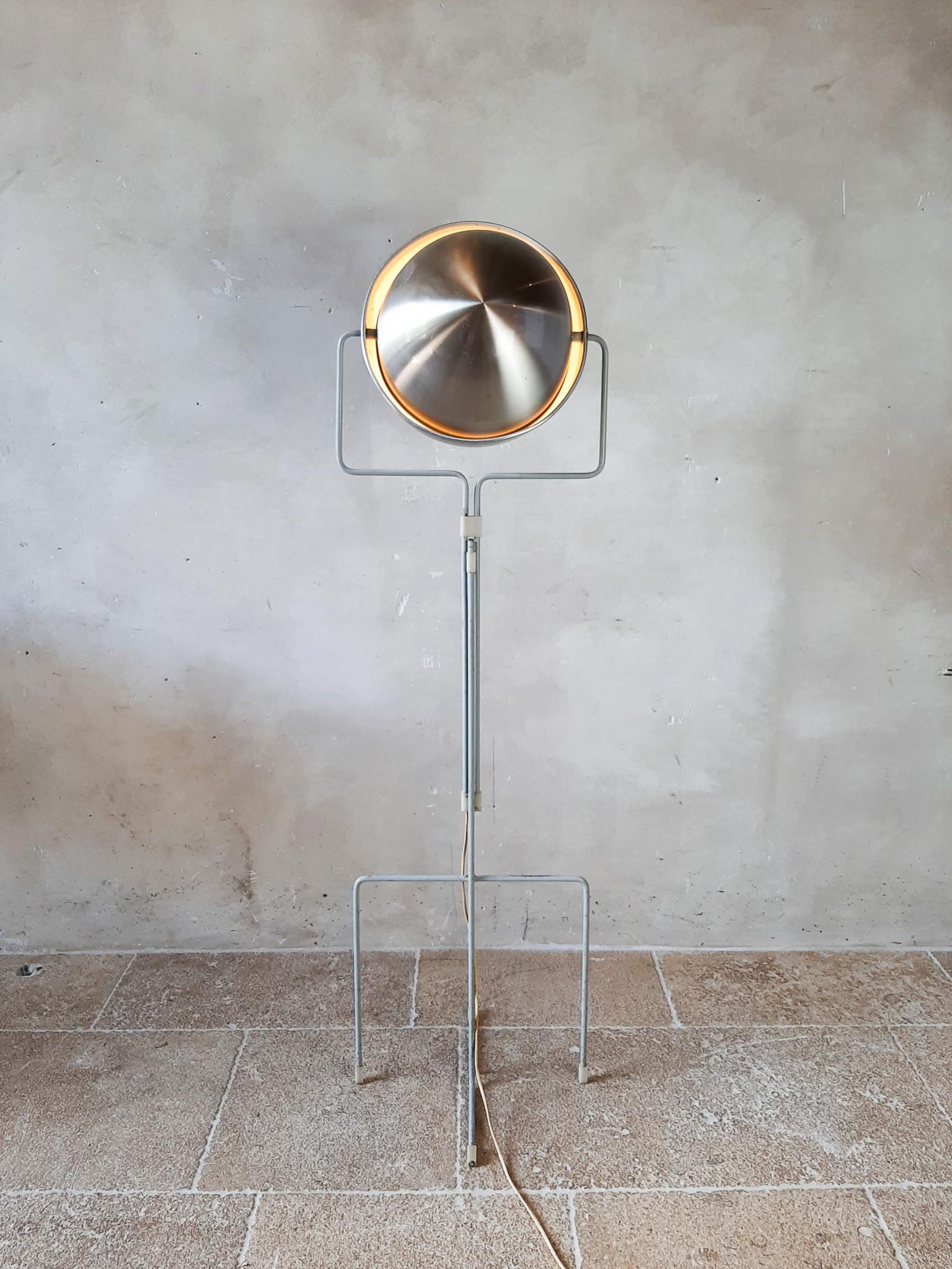 Dutch Modernist floor lamp designed by Architect E.J. Jelles for RAAK Amsterdam, Holland, 1960s. This designer floor lamp has a grey painted symmetrical base which is adjustable in height. The shade can be turned into many different positions making