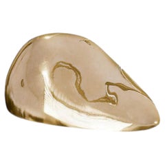 Eclipse II – Polished Brass Pebble Sculpture for Elegant Interior Display