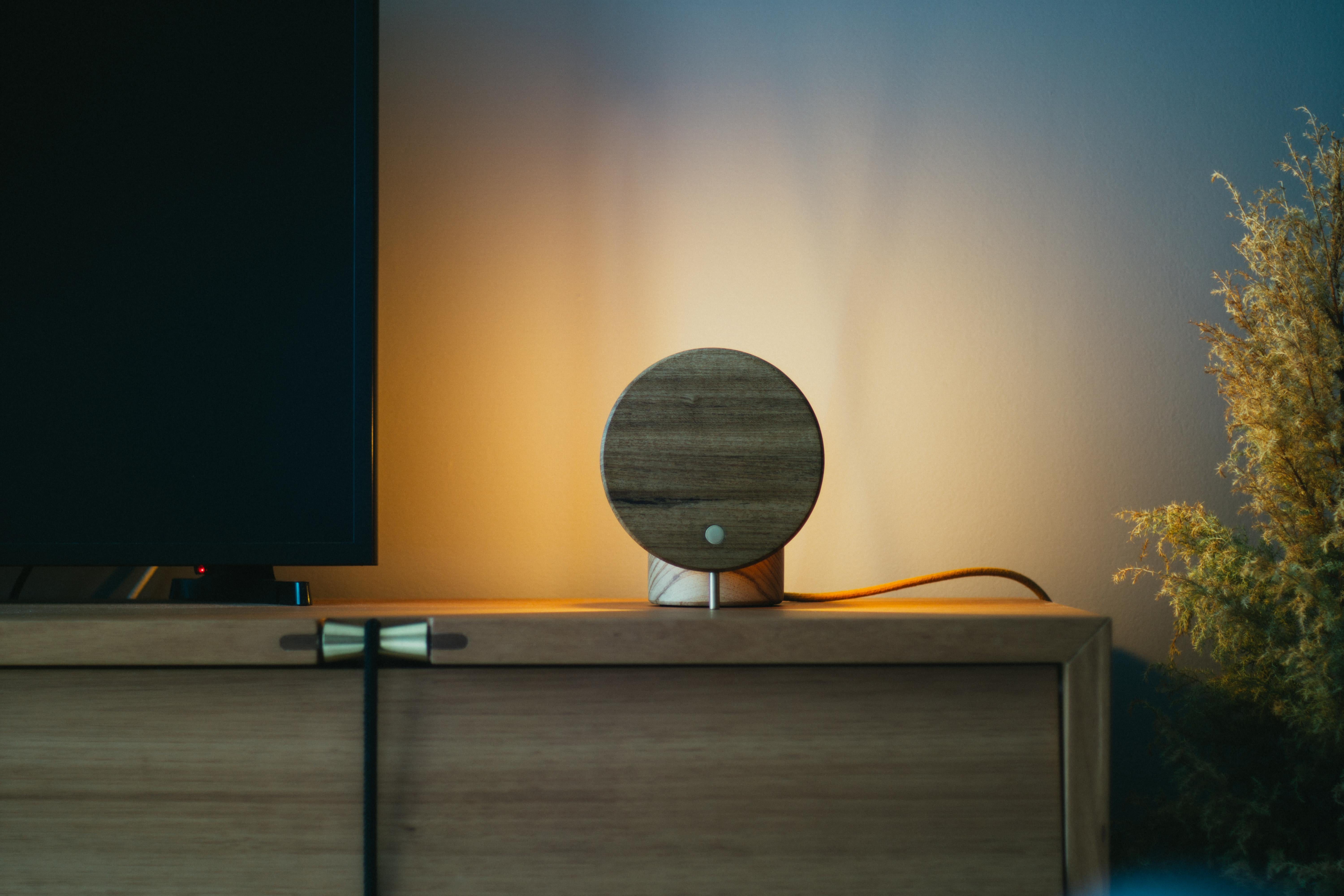 Solid wood table lamp with brass details.
 