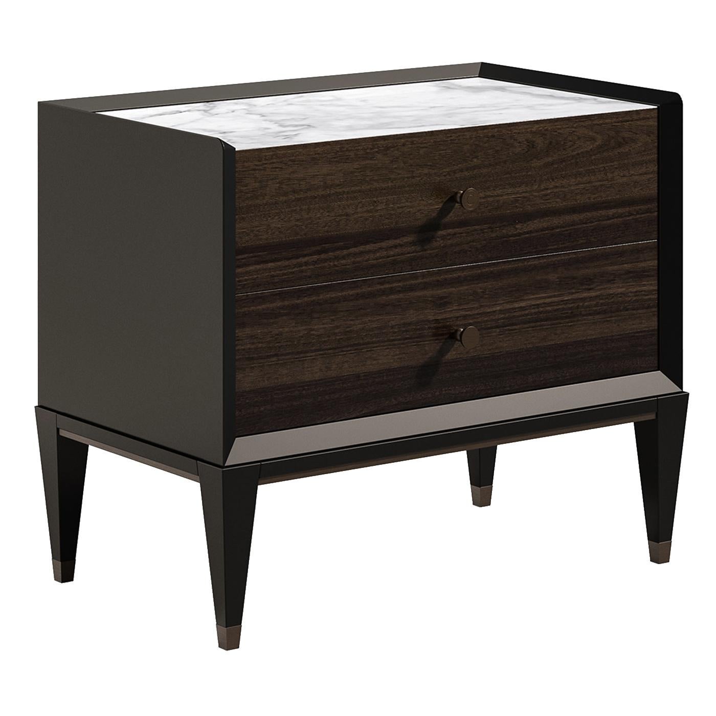 Part of the Eclipse collection, the austere frame of this modern nightstand is finished in black with a velvet-like effect. The encased, two-drawer unit features brown veneered front panels with round metal handles and a striking white marble top.