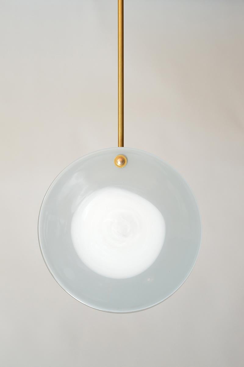 Eclipse pendant by Atelier George
One of a Kind
Dimensions: Ø 25 x 10 cm 
Stem length : 30 cm
Materials: Handblown Glass, Brass fixture
230/240 Volts 50-60 Hz 3 Watt

All our lamps can be wired according to each country. If sold to the USA it