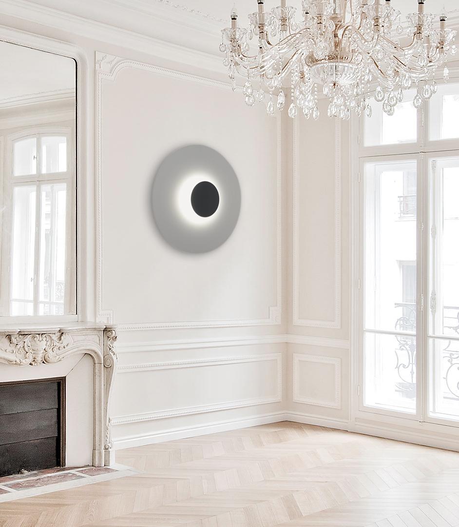 Eclipse Sconce by Arturo Erbsman (Handcrafted design artwork by Arturo Erbsman)
Limited edition, signed and numbered
Dimensions: 59 x 59 x 0.7 cm
Materials: Anodized aluminum disc, mirror, LED spotlight, wood, steel base

All our lamps can be wired