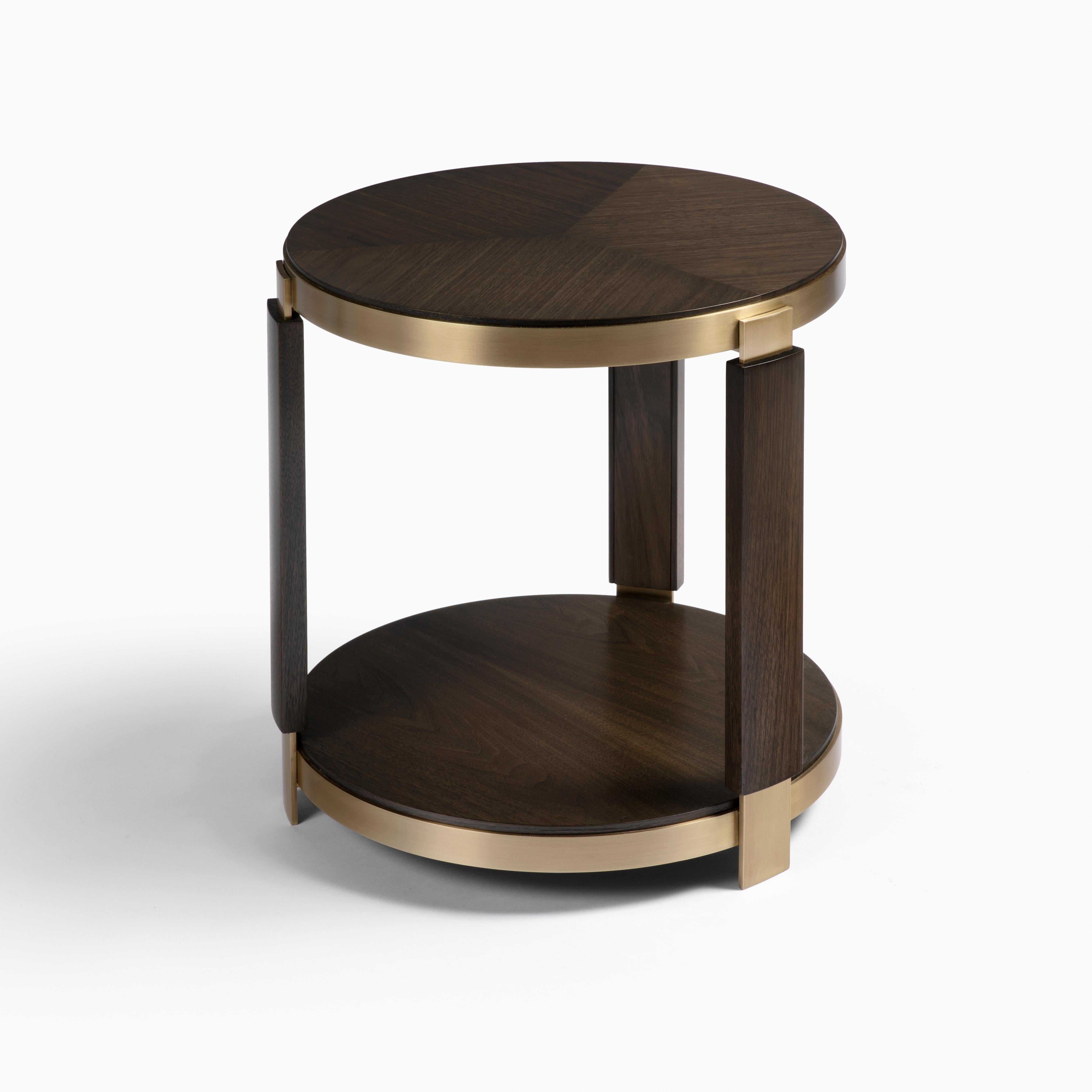 Rich, metal details highlight the hand-applied walnut wood finish on the Eclipse Side Table. Showcasing the beauty of the materials and expert craftmanship, the top features a wood grain pattern design with accented legs and lower shelf. Choose from