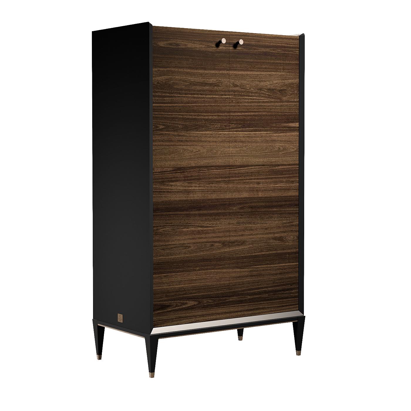 This remarkable cabinet blends light and dark woods in a modern design to bring style and functionality to any decor. The design showcases a tall rectangular unit with veneered door encased in a clean-cut wooden frame with black, velvet-like finish.
