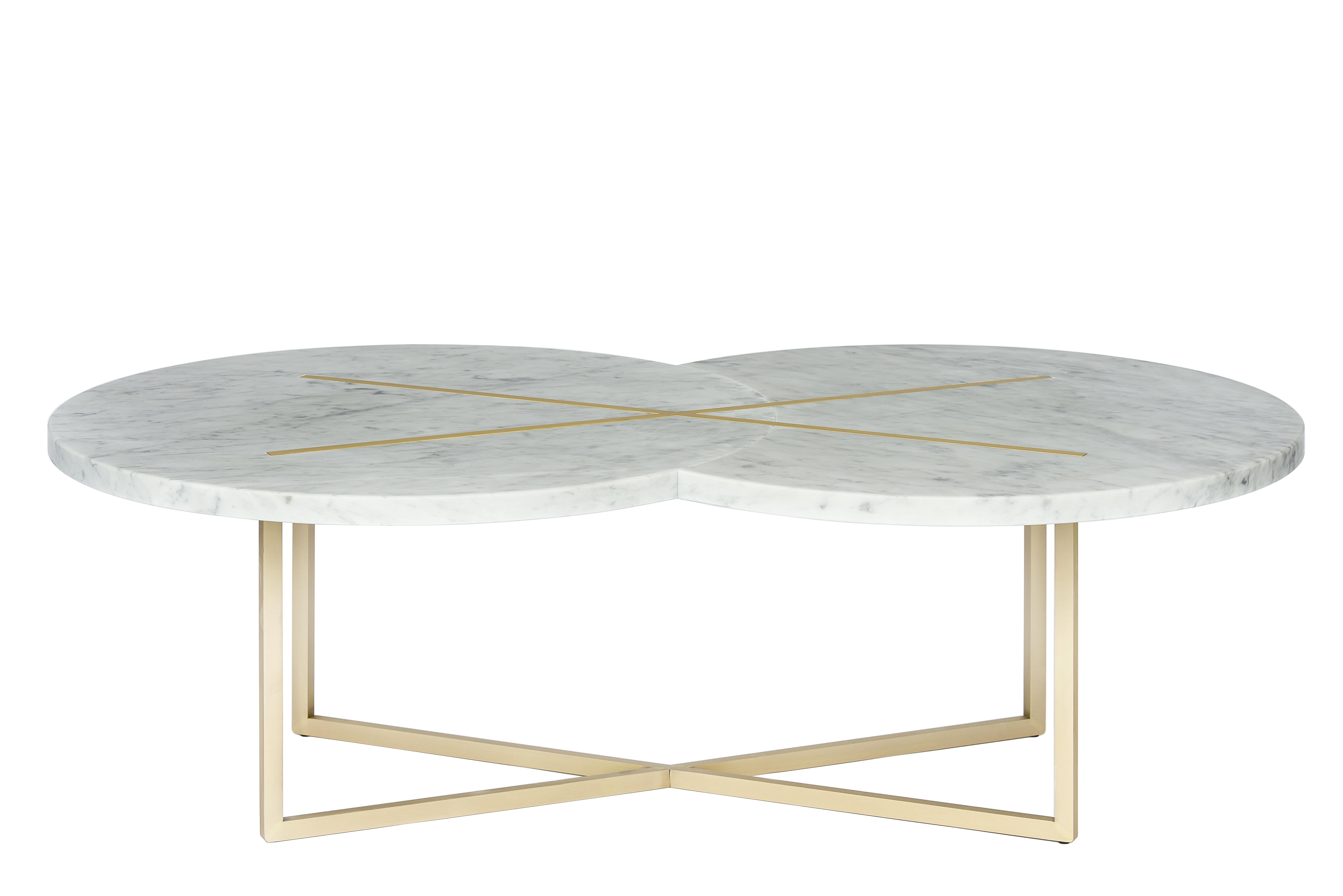Eclipse X coffee table by Hagit Pincovici.
Dimensions: 130 L x 76 W x 40 H
Materials: Carrara marble, brass

Hagit Pincovici founded her eponymous bespoke luxury furniture and lighting atelier in 2014. Known in her earlier work for a rich color