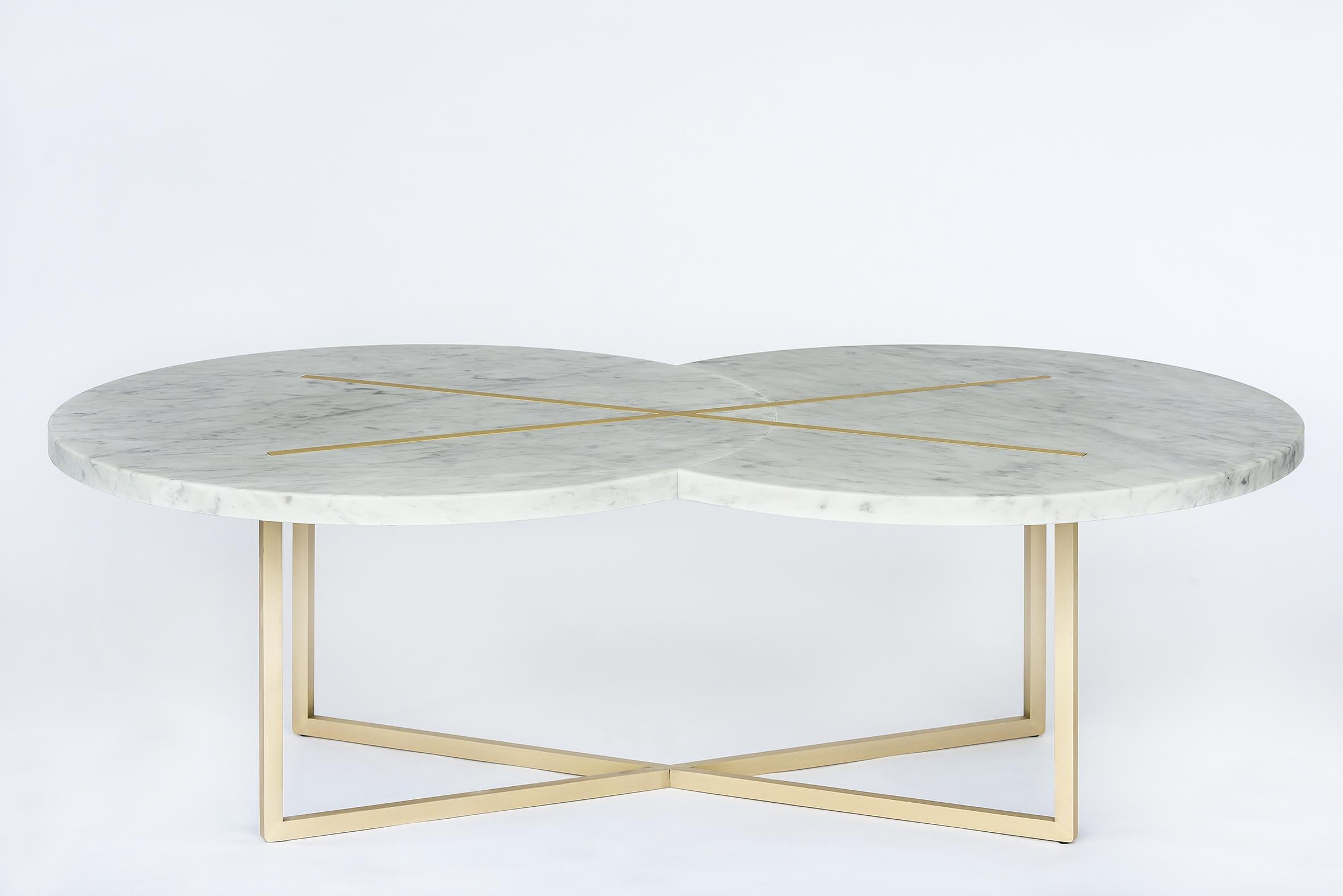 A coffee table that resembles the magical crossing between two white planets that are stroked by the blasting ray of light made with golden brass. 

The mysterious function of the universe that expresses the most stunning beauty in its very own